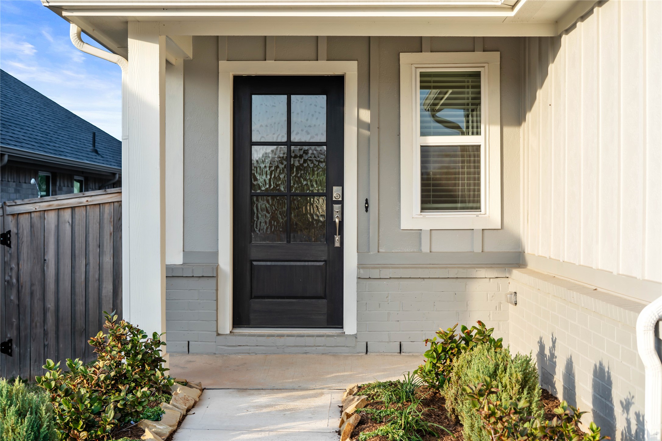 This home is modern elegance with a timeless siding and brick combination exterior and a high quality entry door.