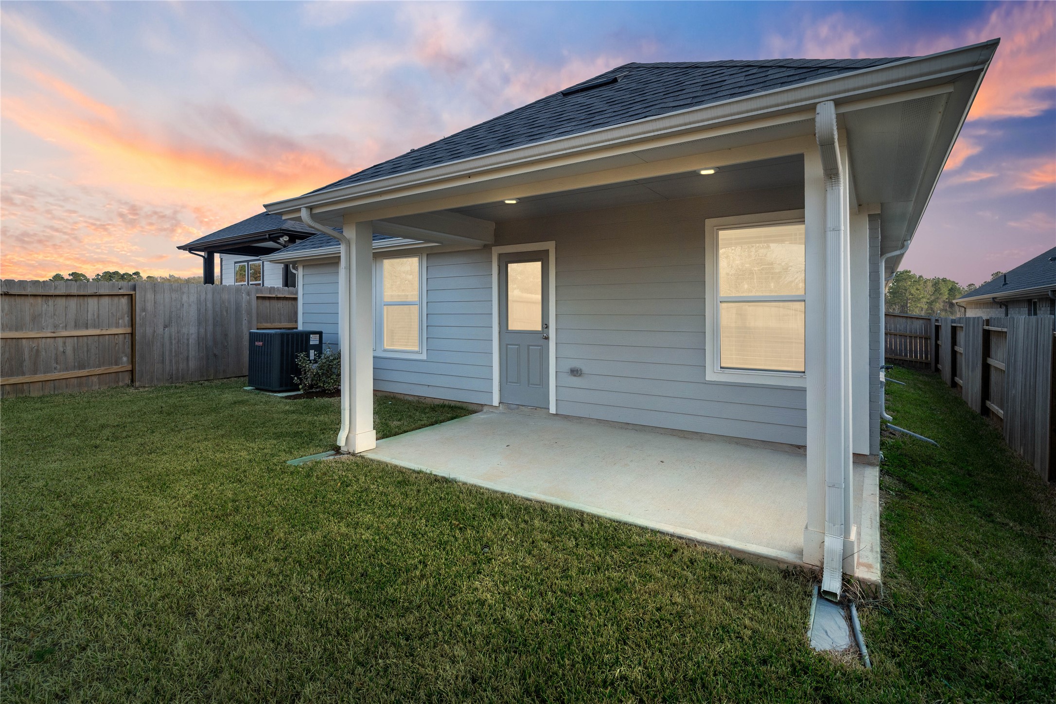 The spacious covered patio offers a tranquil outdoor retreat, perfectly designed for savoring your quiet morning coffee or unwinding during peaceful evening relaxation.