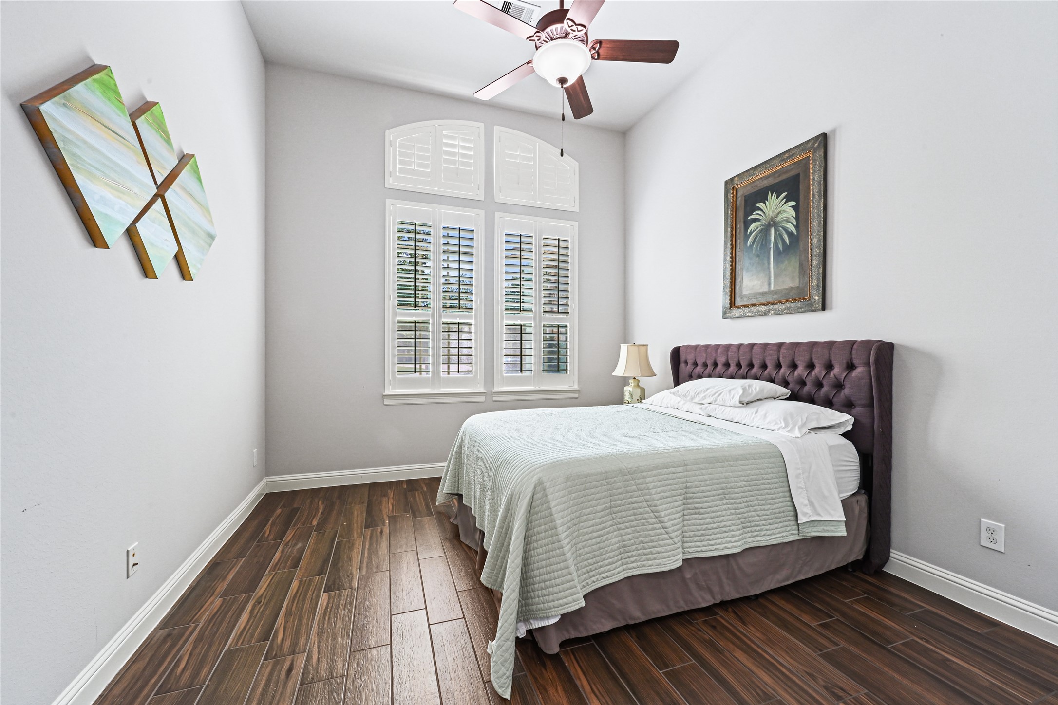 Just off the stunning grand entry, discover another spacious guest bedroom thoughtfully tucked away from the main living areas for added peace and privacy! A wonderful retreat for family or overnight guests, offering comfort and separation from the heart of the home.