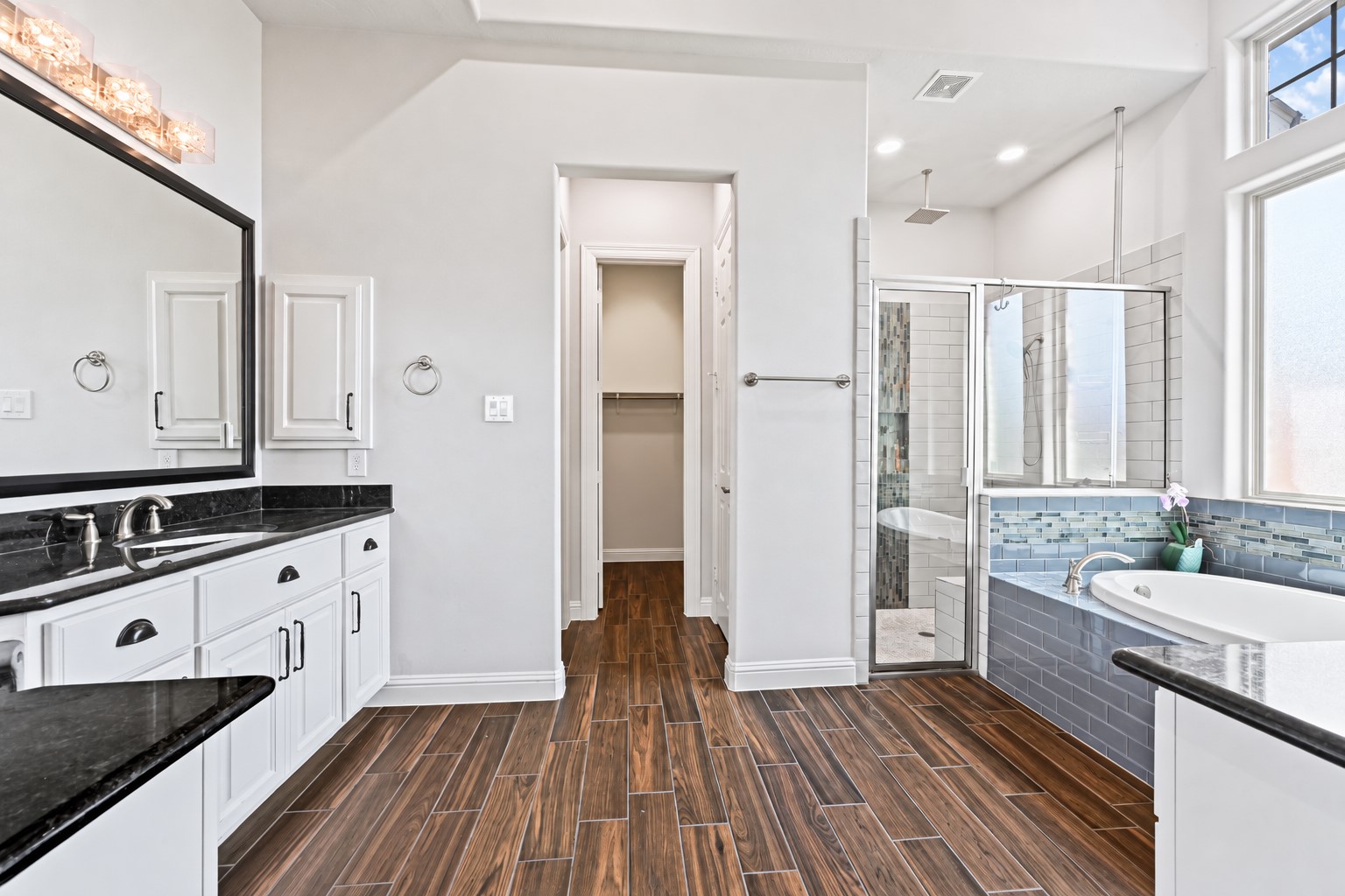 This custom home continues to impress with thoughtful storage throughout! The primary bathroom features a large linen closet for all your everyday essentialsand just wait until you see the incredible walk-in closet! Plenty of space, storage & custom touches designed for easy living!