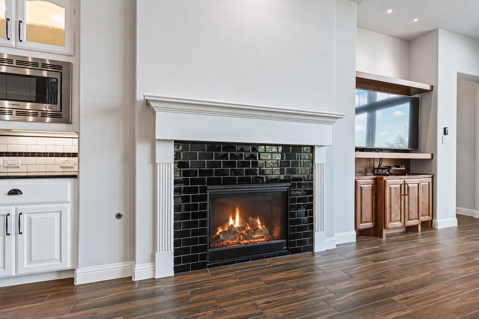 Take a closer look at the incredible detail of this custom fireplacewhat a stunning centerpiece for the family room! Now, lets head back into that fabulous gourmet kitchen because there is still so much more to show you! Custom details are everywhere you look in this amazing home. Have you made that call yet?