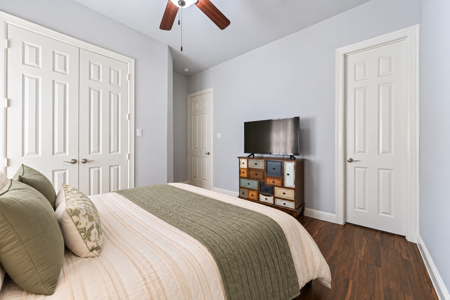 Your private Guest Suite features beautiful, carefree large-plank wood-look tile flooring and its own private bathroom just steps away! A comfortable, stylish retreat designed to give your guests the privacy they deserve. Photo is Virtually Staged.