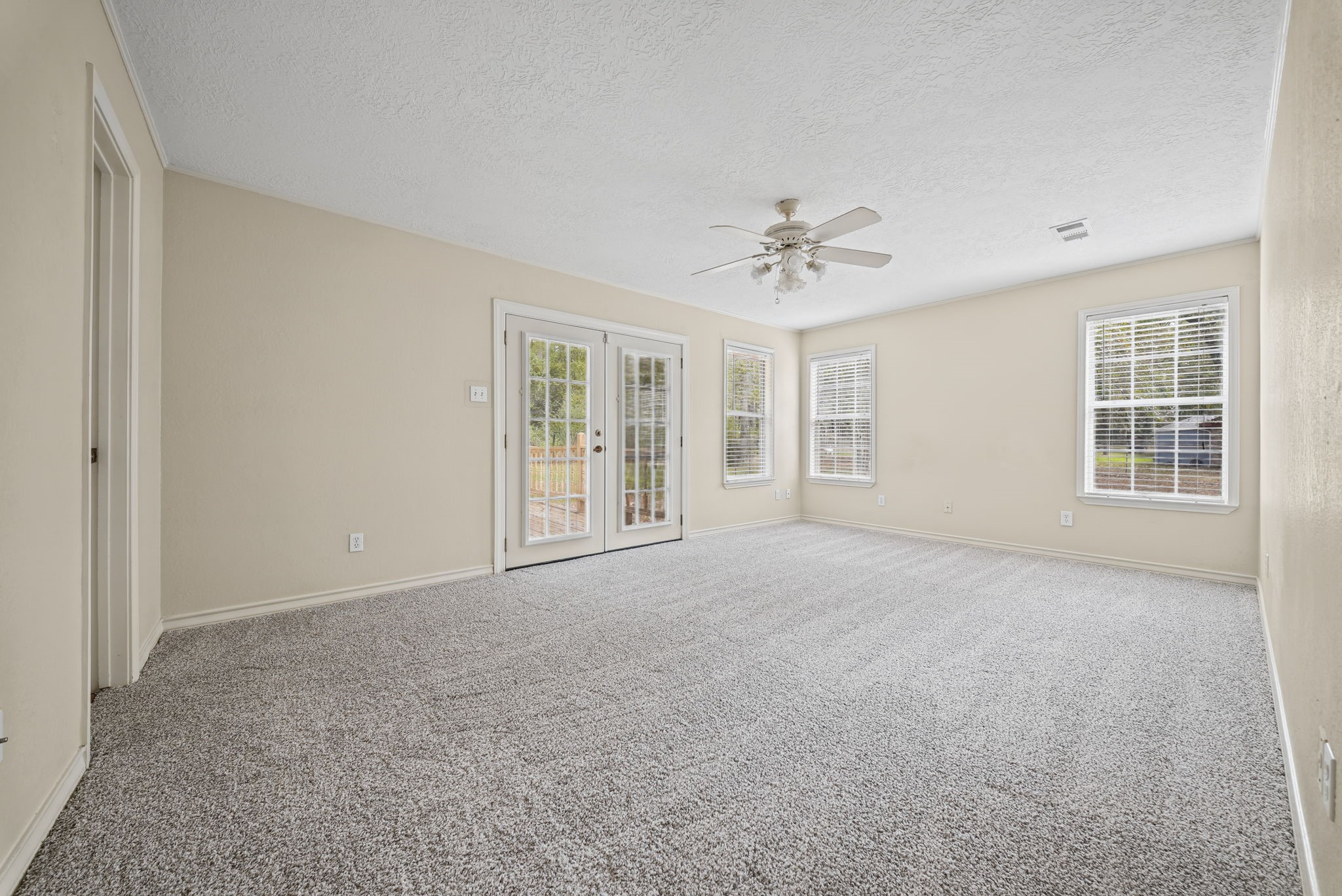 Primary with access to back patio.