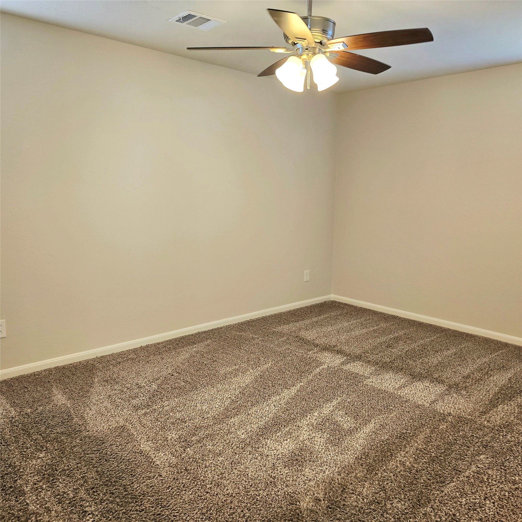 2nd bedroom upstairs. Ceiling fan with light fixtures.
