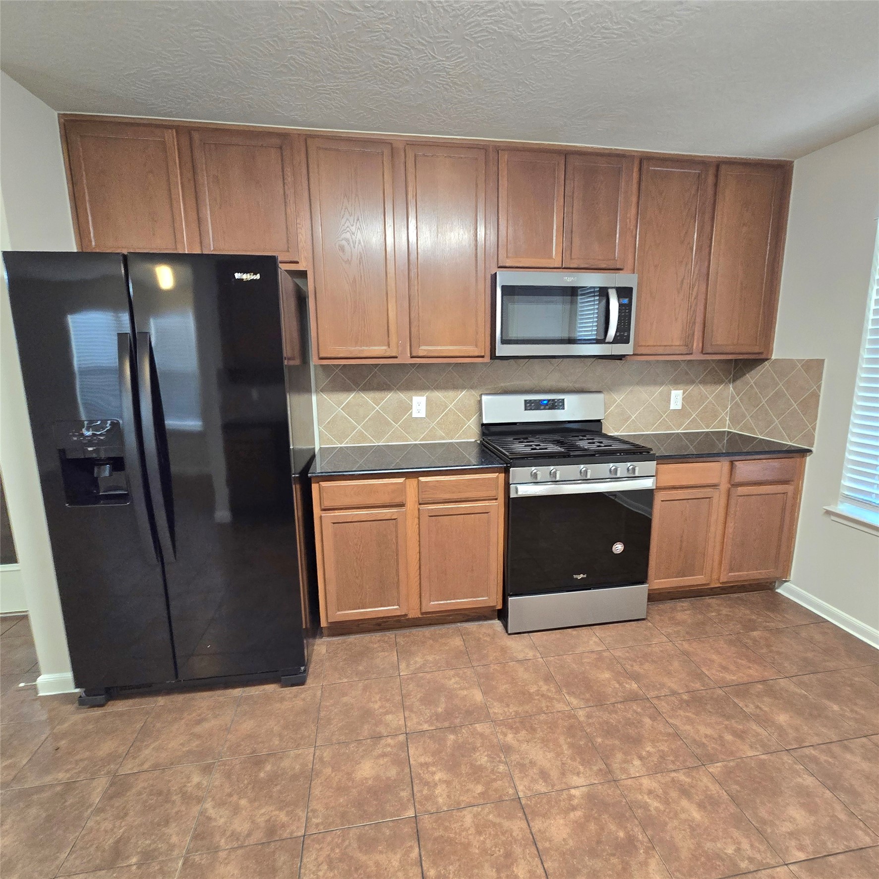 Well equipped kitchen, with plenty of cabinets. Tile floors. Well equipped kitchen, with plenty of cabinets. Tile floors.