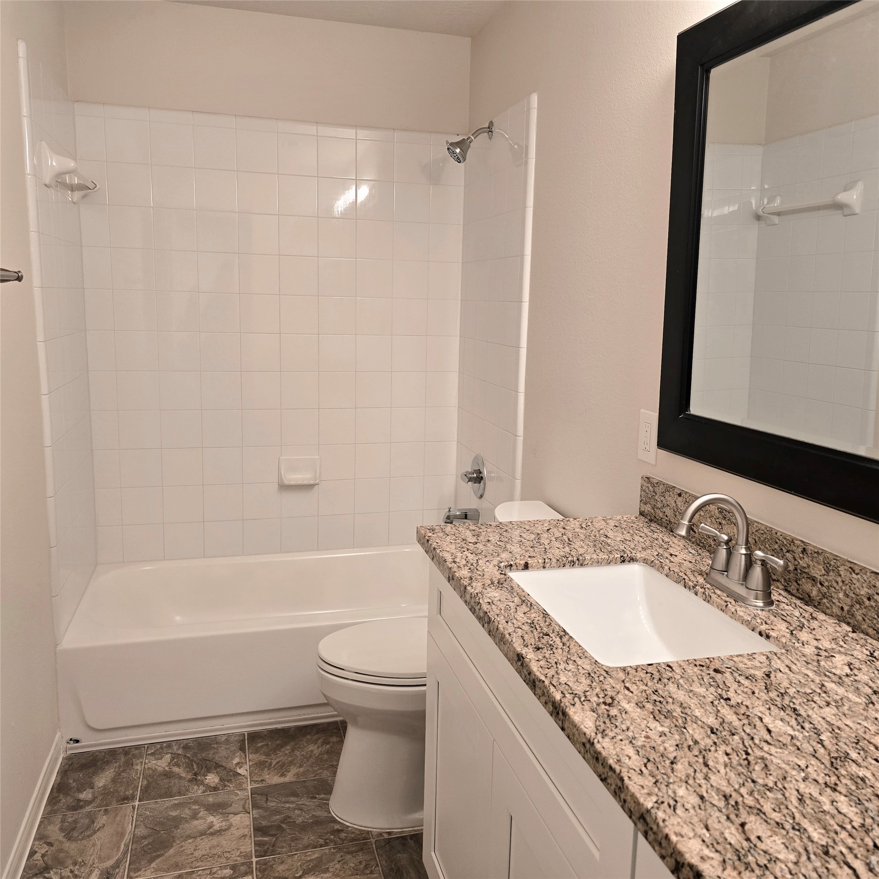 2nd bathroom. Updated with granite countertop and under-counter sink.