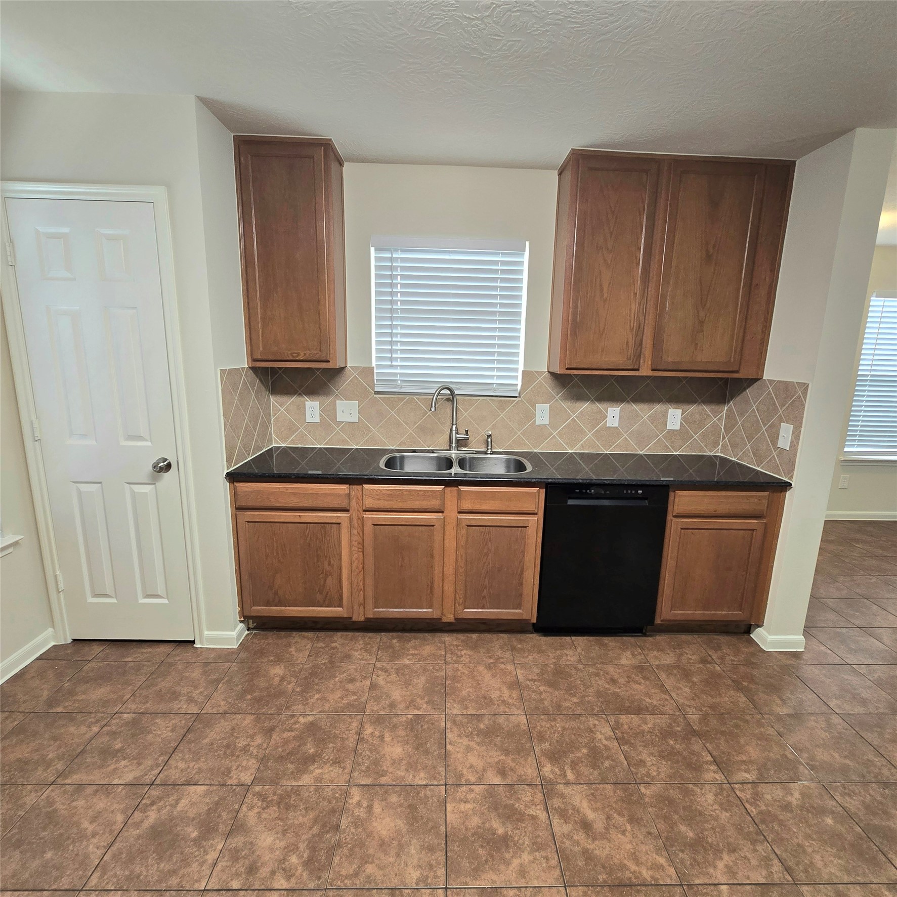 Double sink with granite countertop