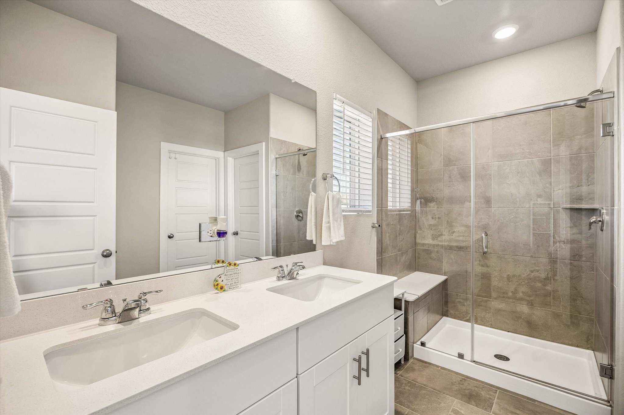 Private primary bathroom offers a dedicated place to refresh and rejuvenate, bringing comfort and convenience to your morning and evening routines.