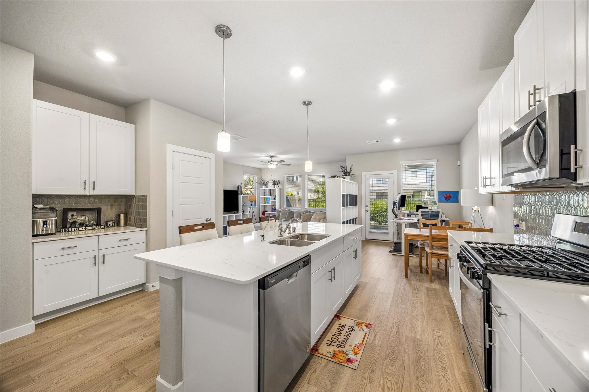 A charming kitchen bar area offers the perfect little spot for your morning coffee, afternoon pick-me-up, or favorite beverage essentials.