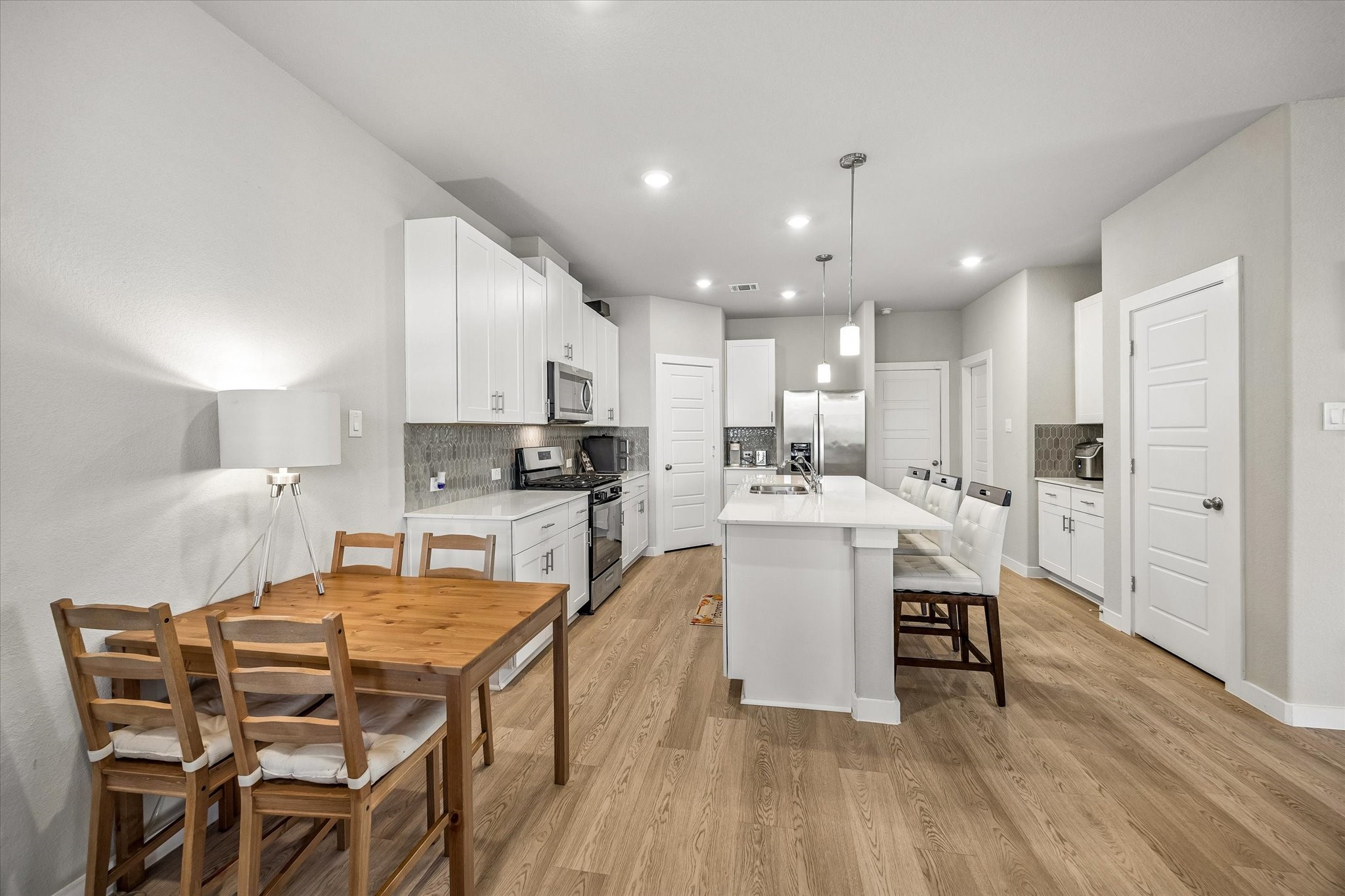 Whether envisioned as a dedicated workspace or a place to gather for meals, this multifunctional room offers options to suit your preferences.