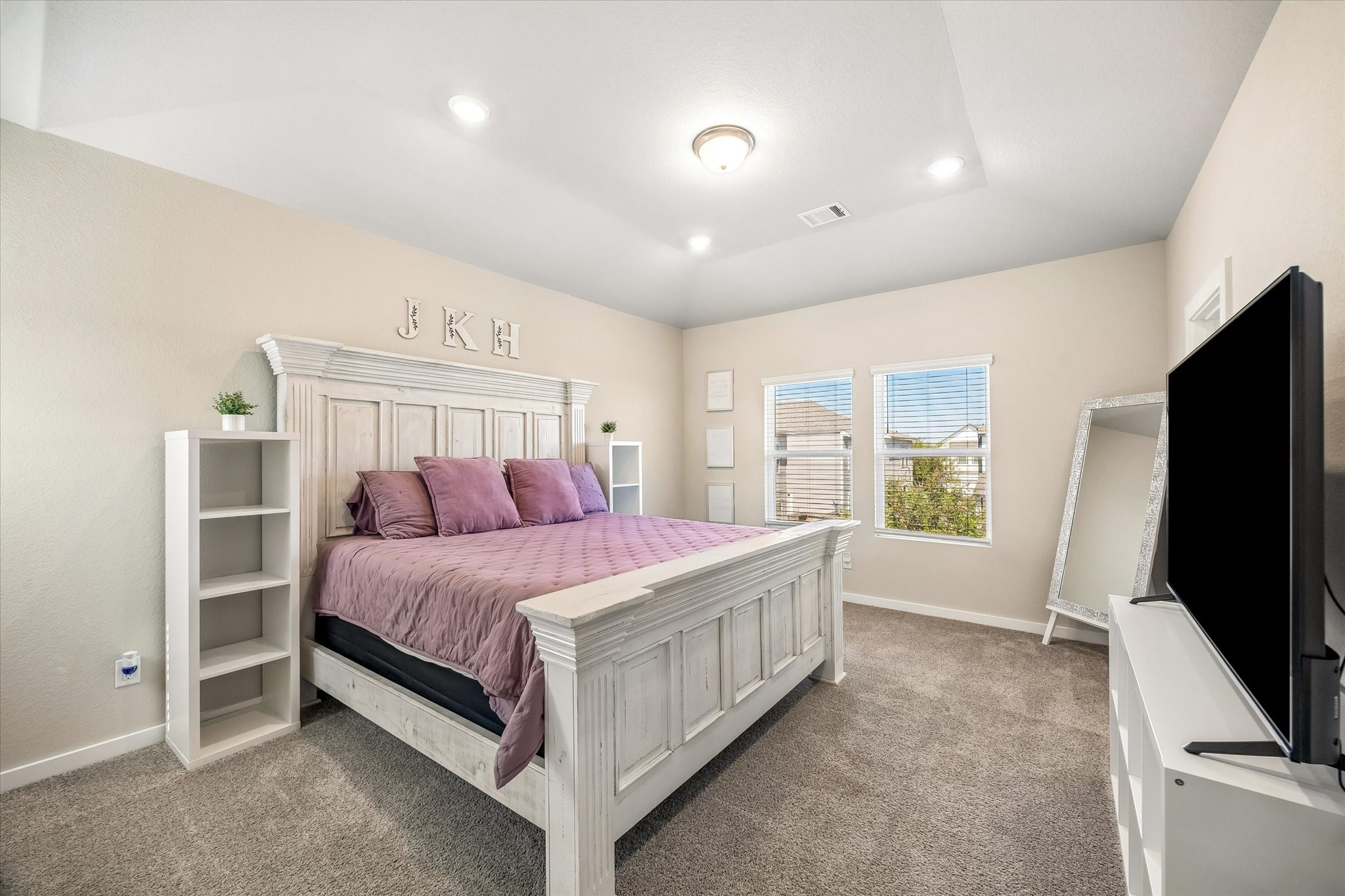 Retreat to the primary bedroom, a peaceful setting to unwind, recharge, and settle in after a long day.