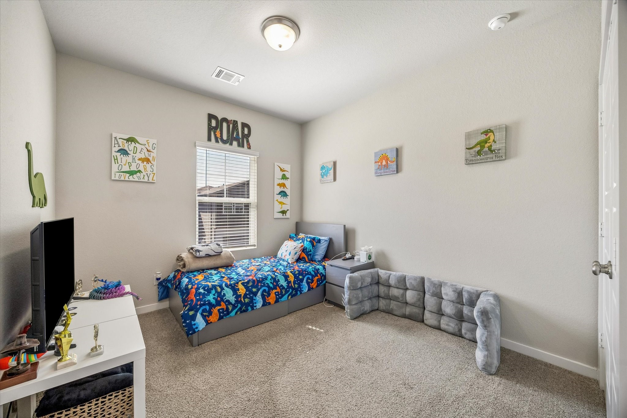 Welcoming guest bedroom offers a comfortable place for overnight visitors or a flexible setting for whatever your lifestyle calls for.