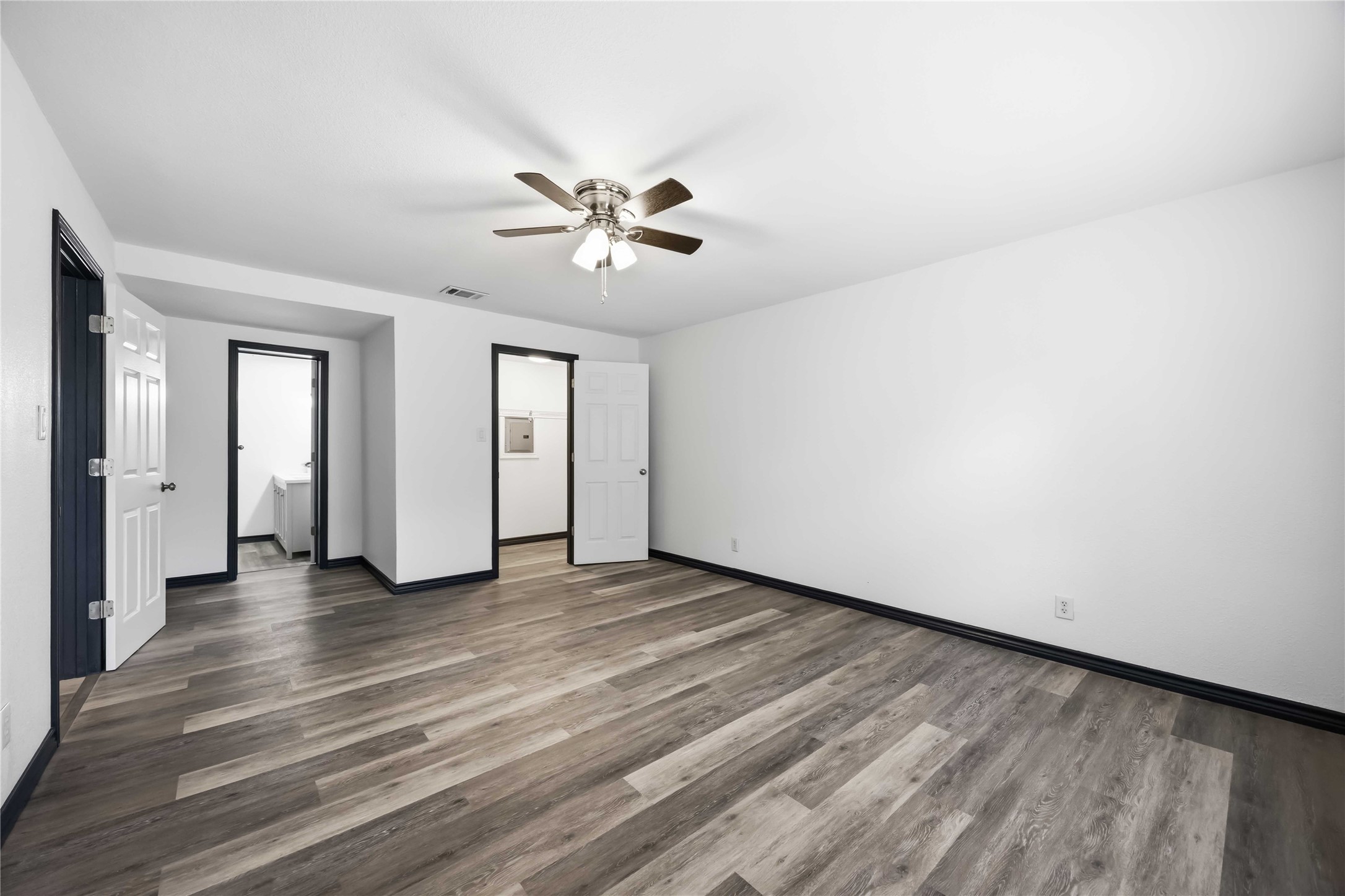 In this converted garage, a full bathroom and a walk-in closet.