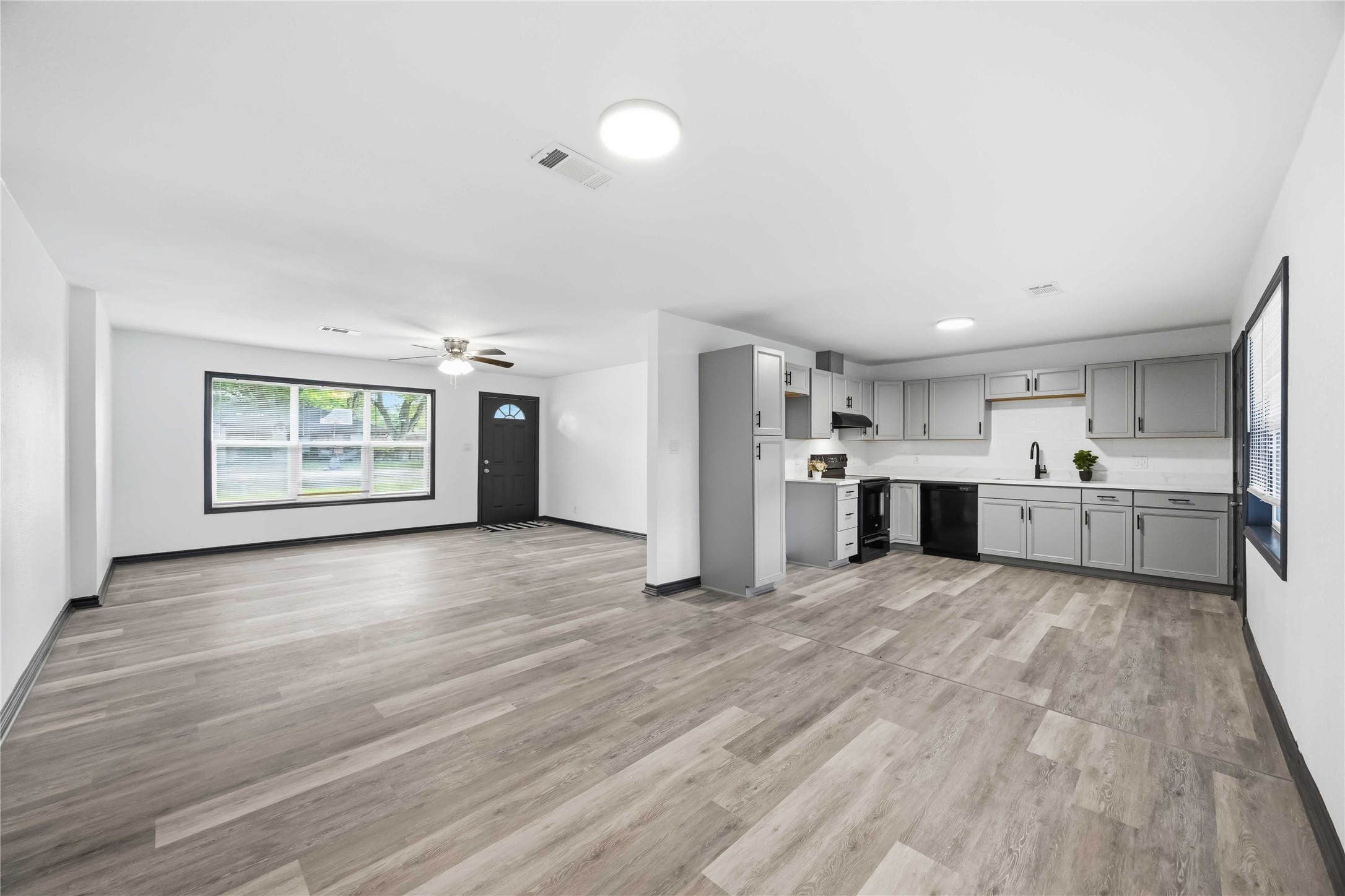 Reverse view of this remodeled kitchen with a neutral color palette.