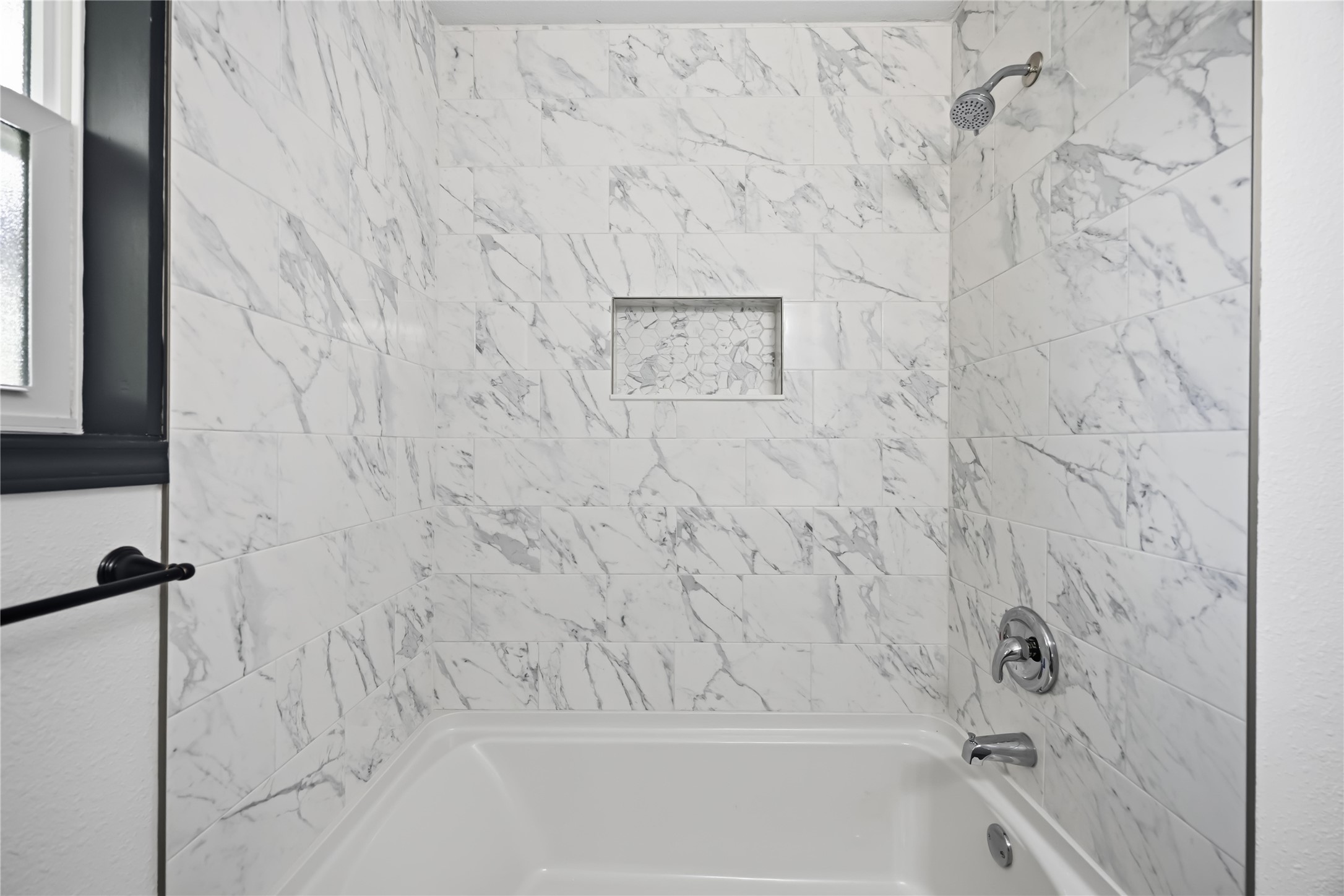 Bathtub in secondary bathroom.