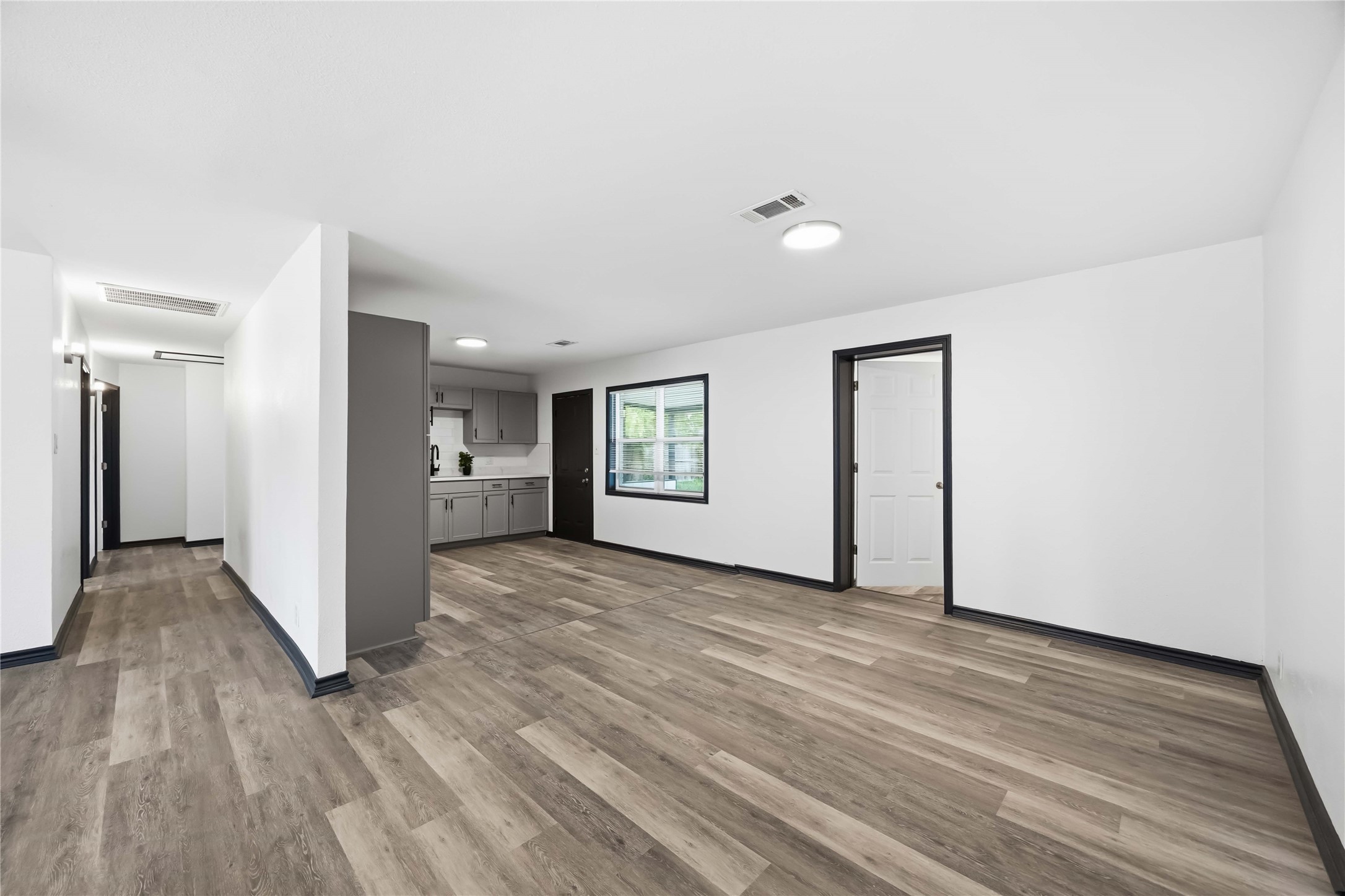 Easy, open flow for entertaining. Door here leads to the utility room.