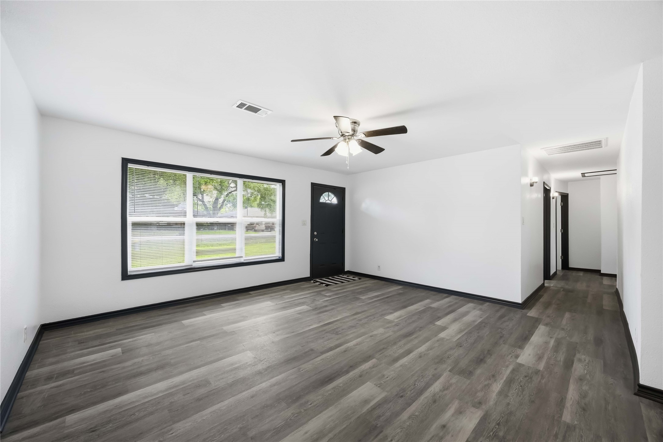 Just inside the front door, new flooring greets you throughout. New paint, new windows.