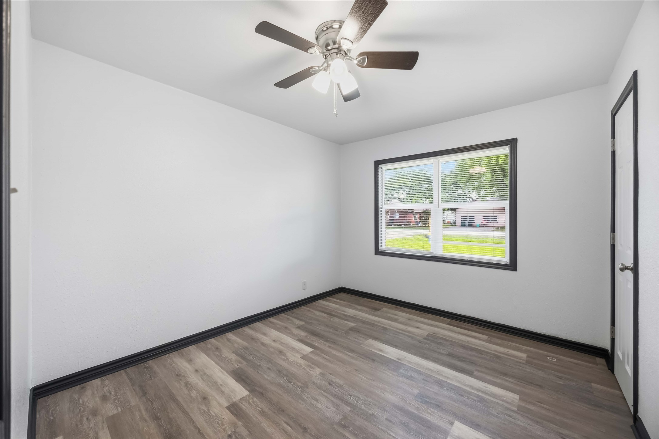 Secondary bedroom facing the front yard.