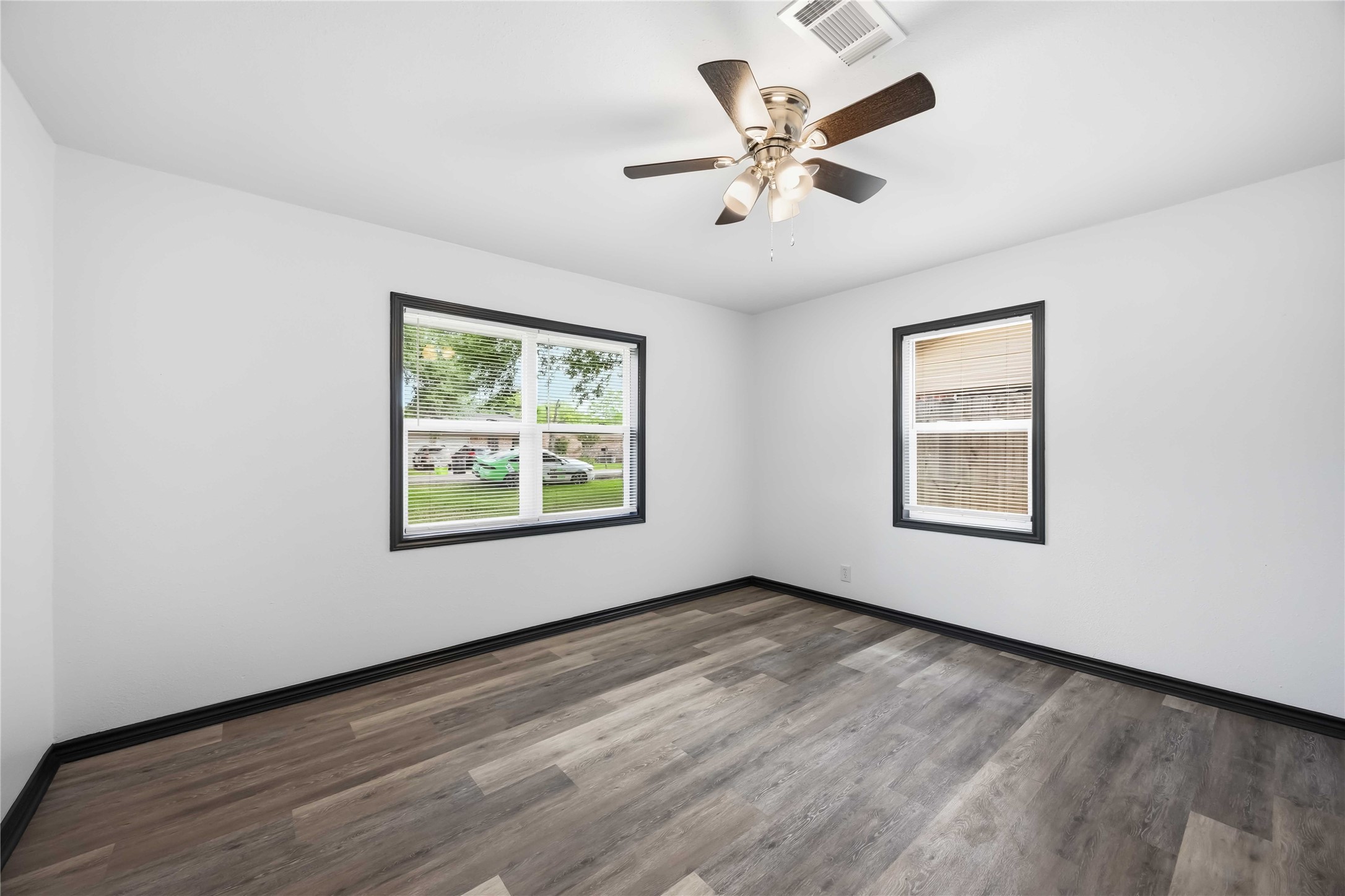 Secondary bedroom facing the front yard.