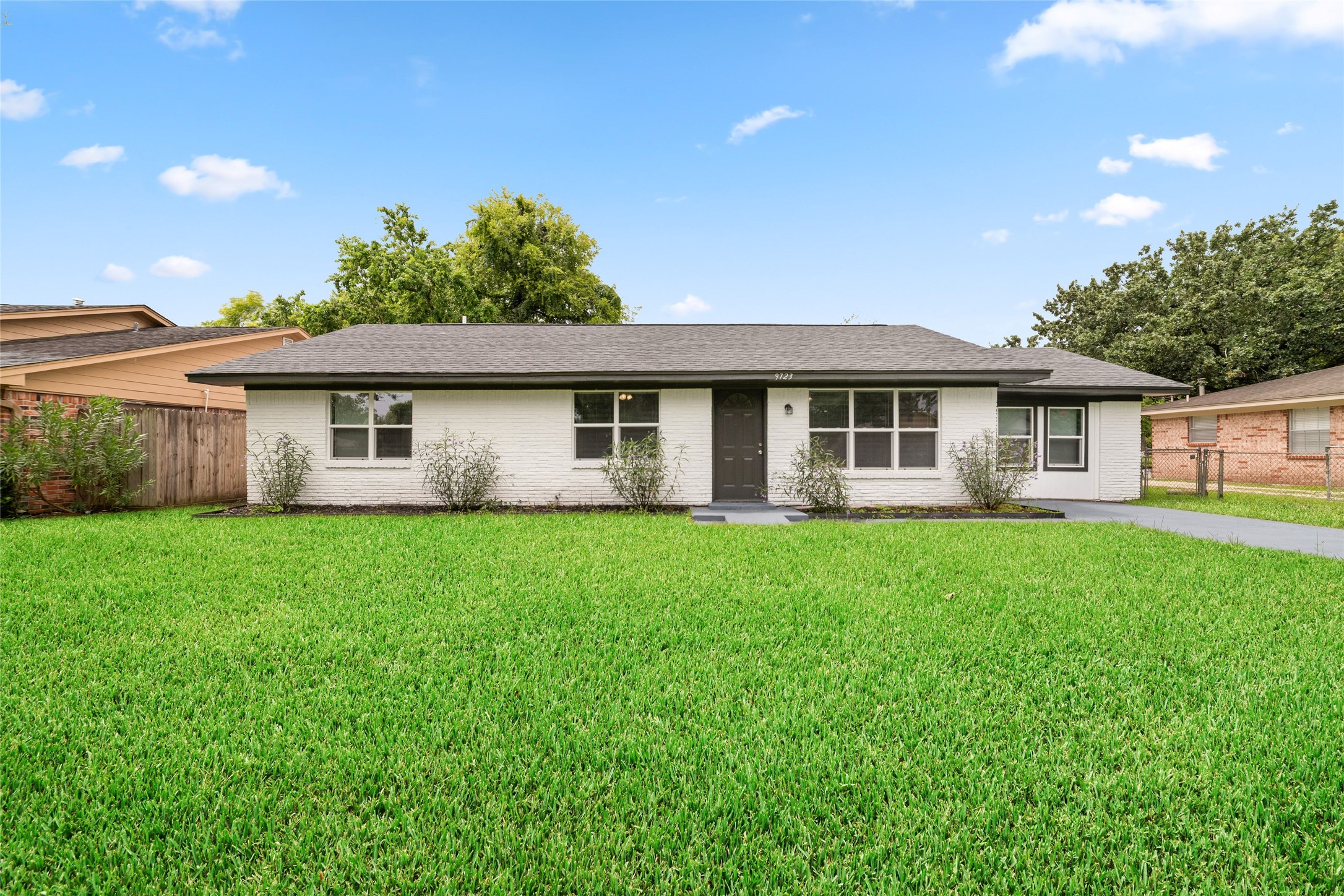 Welcome to 9723 Oldcrest Drive. Beautiful front yard welcomes you. Plenty of driveway parking and street parking.