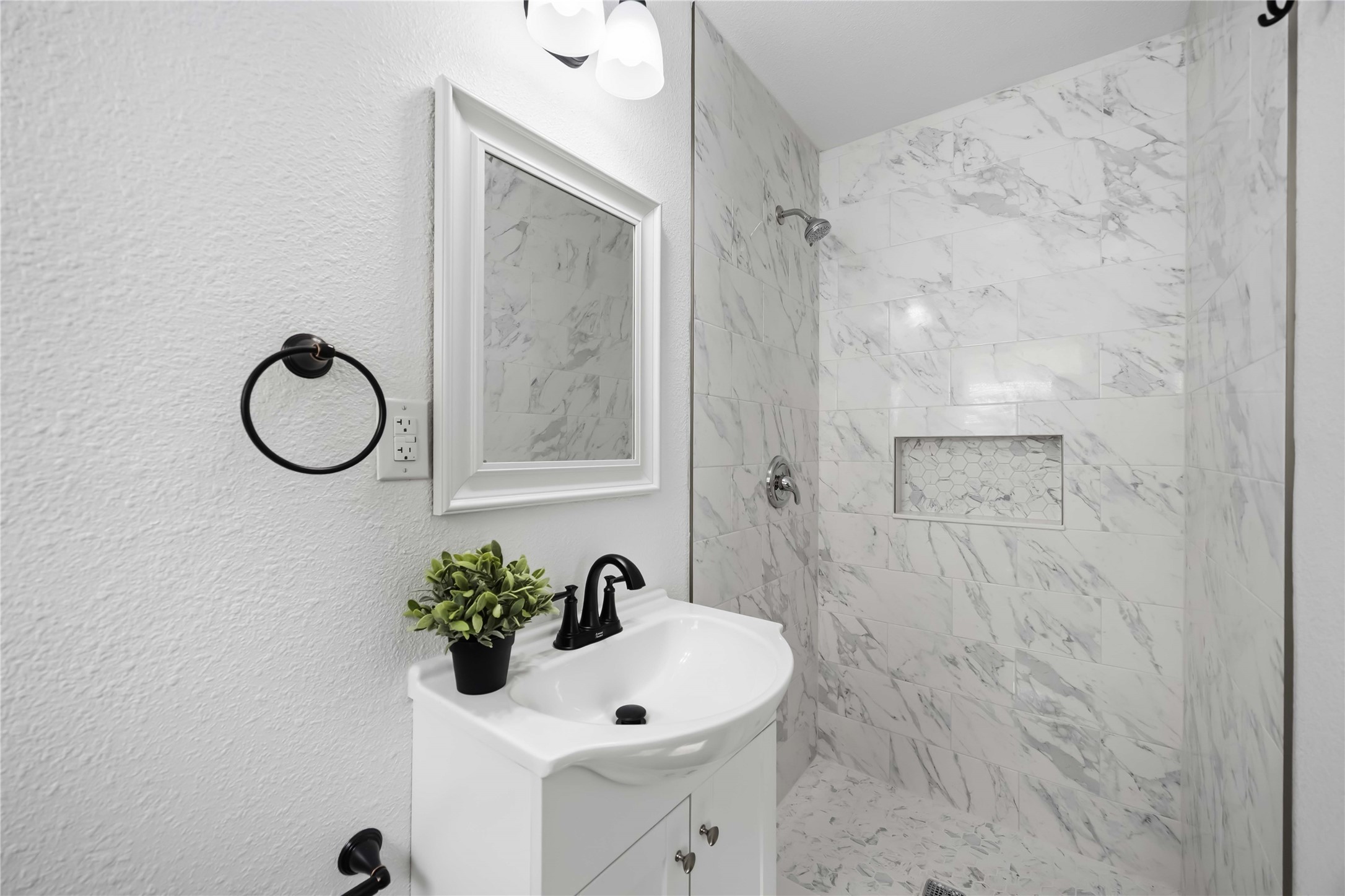 Third full bathroom with a stand-up shower.