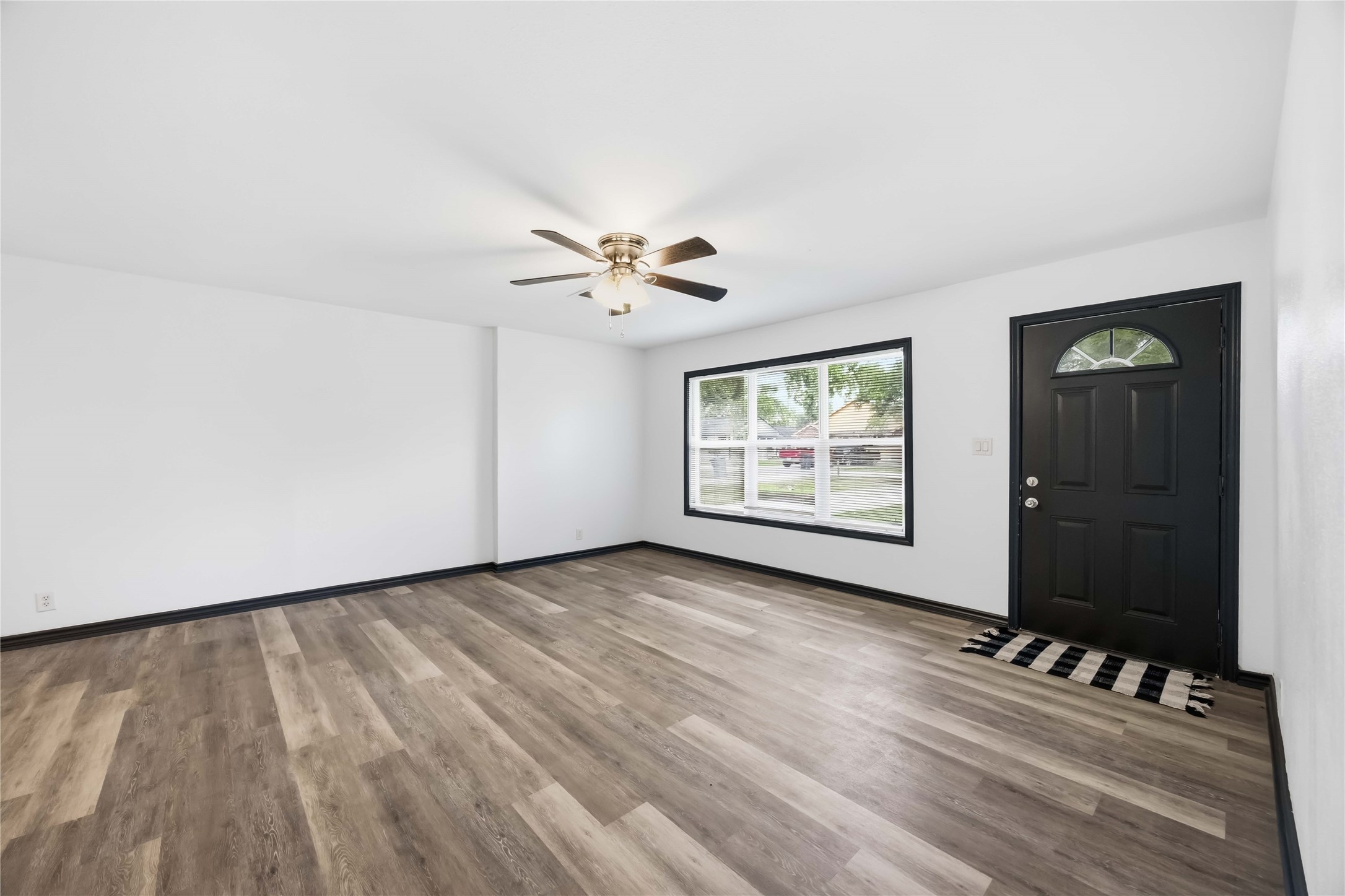 Large living room window for ample natural light.