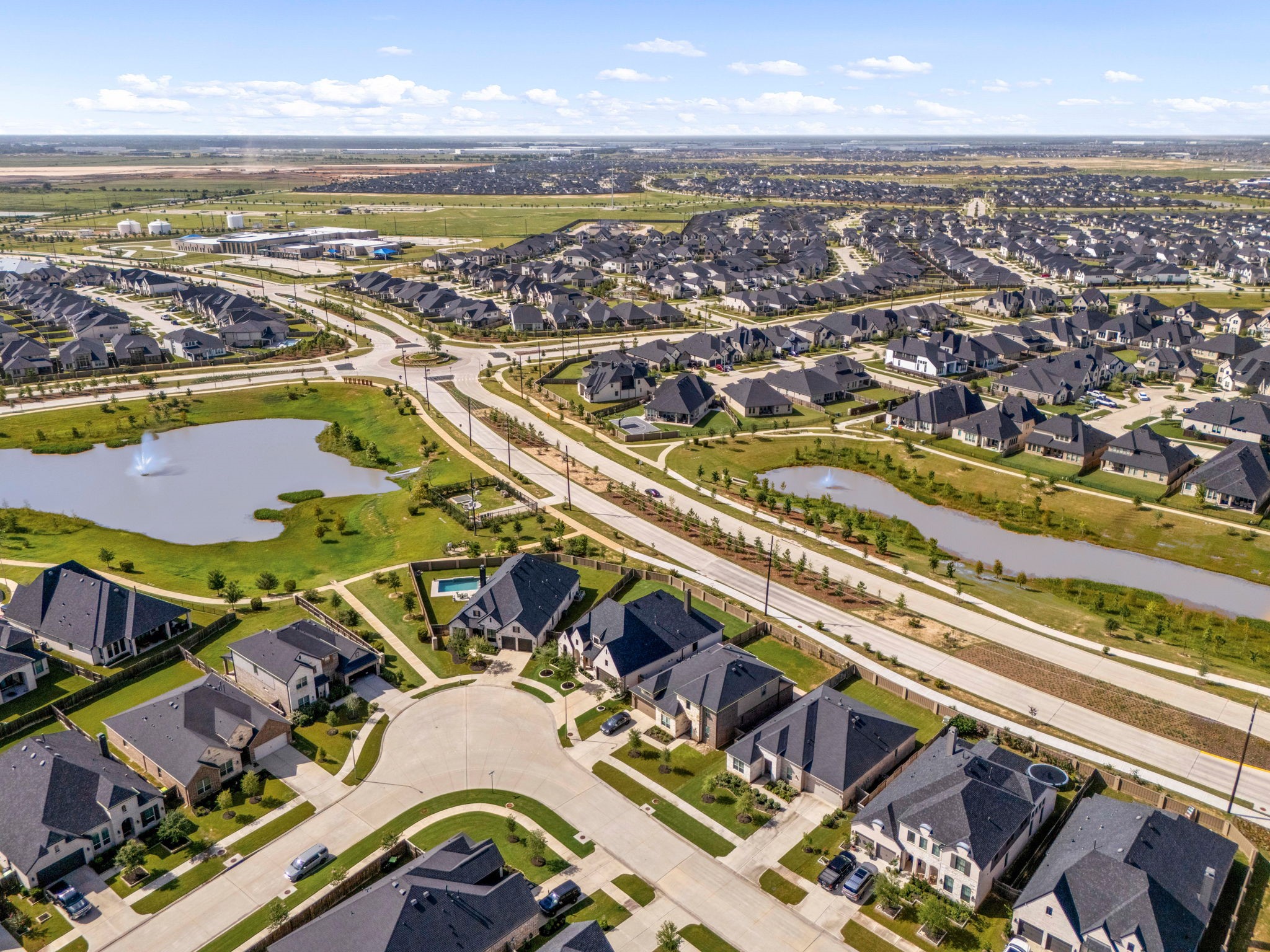 An exceptional location tailored for leisure. This aerial pinpoint details the home's proximity to a wealth of first-class neighborhood amenities, including stocked fishing lakes, a scenic 60-acre nature preserve with walking paths, a state-of-the-art fitness center, a neighborhood playground, and a resort-style community pool.