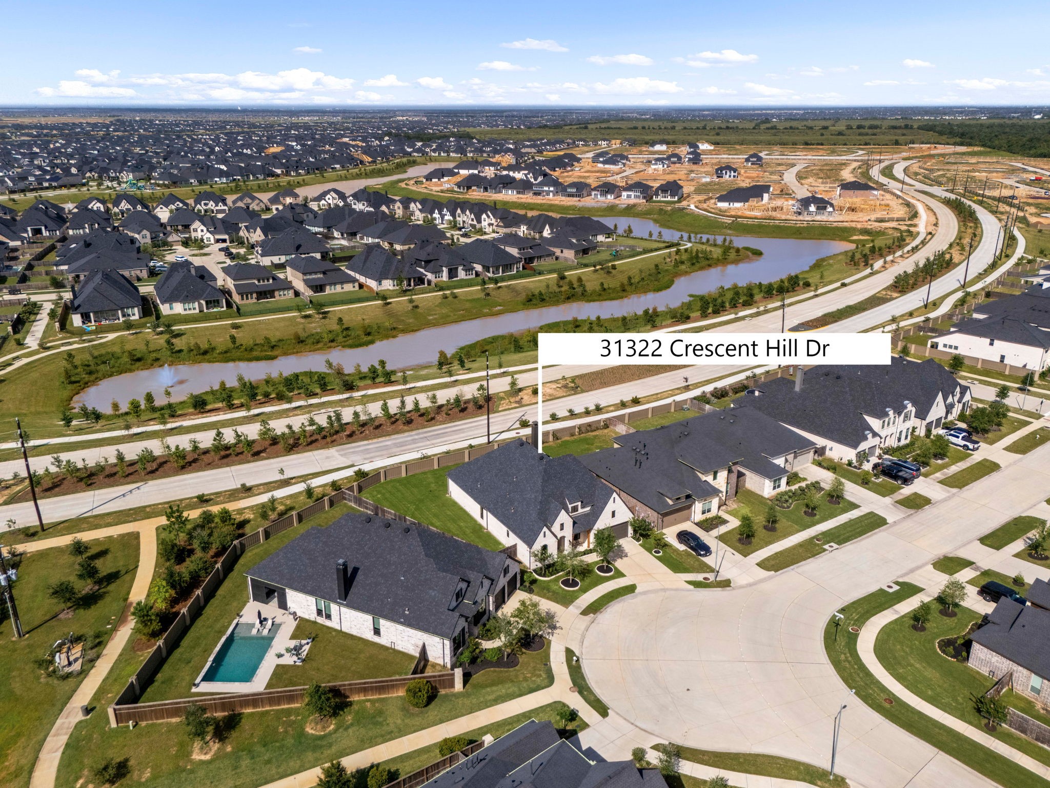 Perfect location in Cross Creek West. This clear aerial highlight marks the home's premier position within the community, showcasing its close proximity to the scenic neighborhood waterway, paved walking paths, and beautiful green spaces.