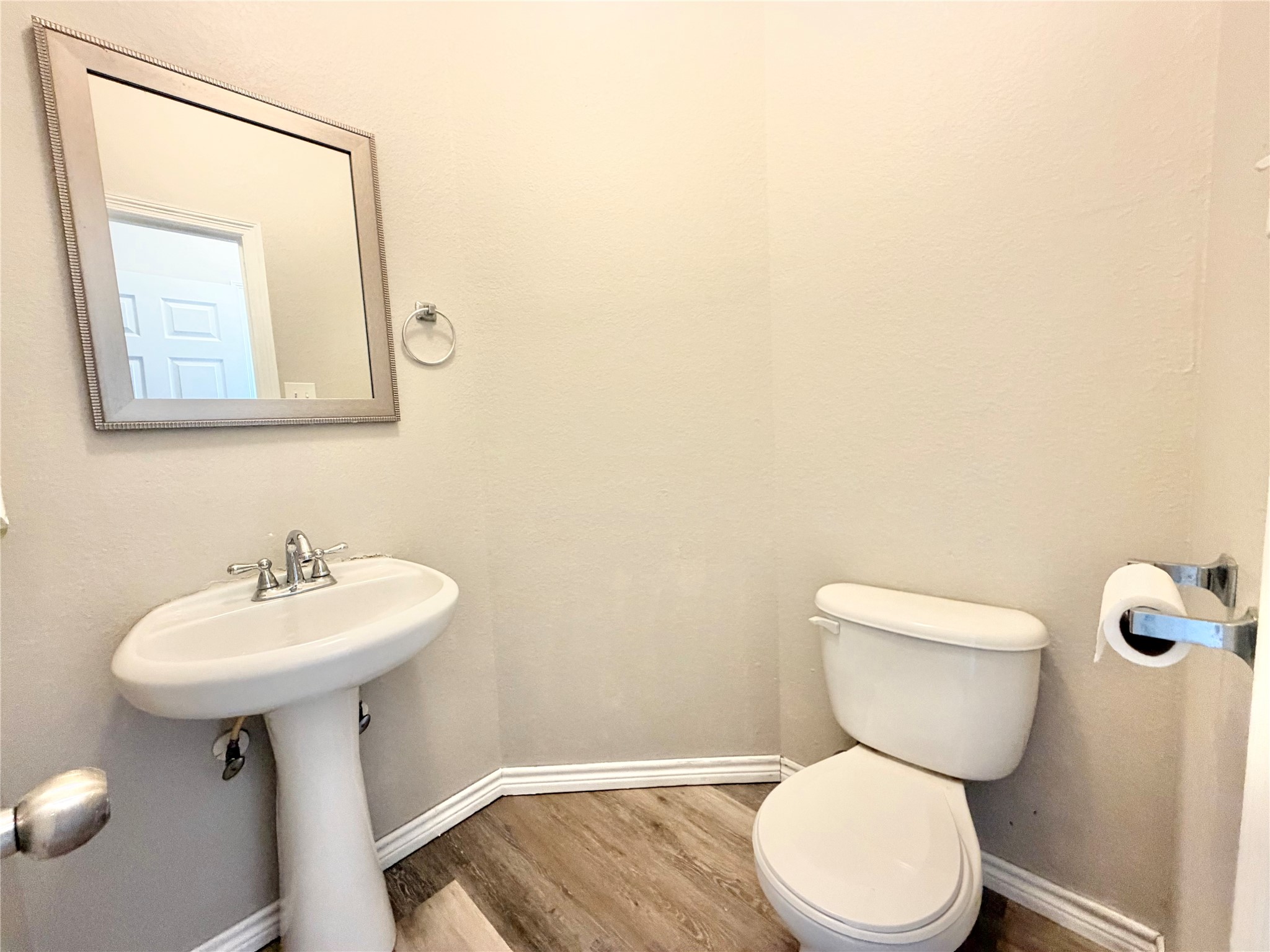 Powder room, half bath conveniently located just off the family room