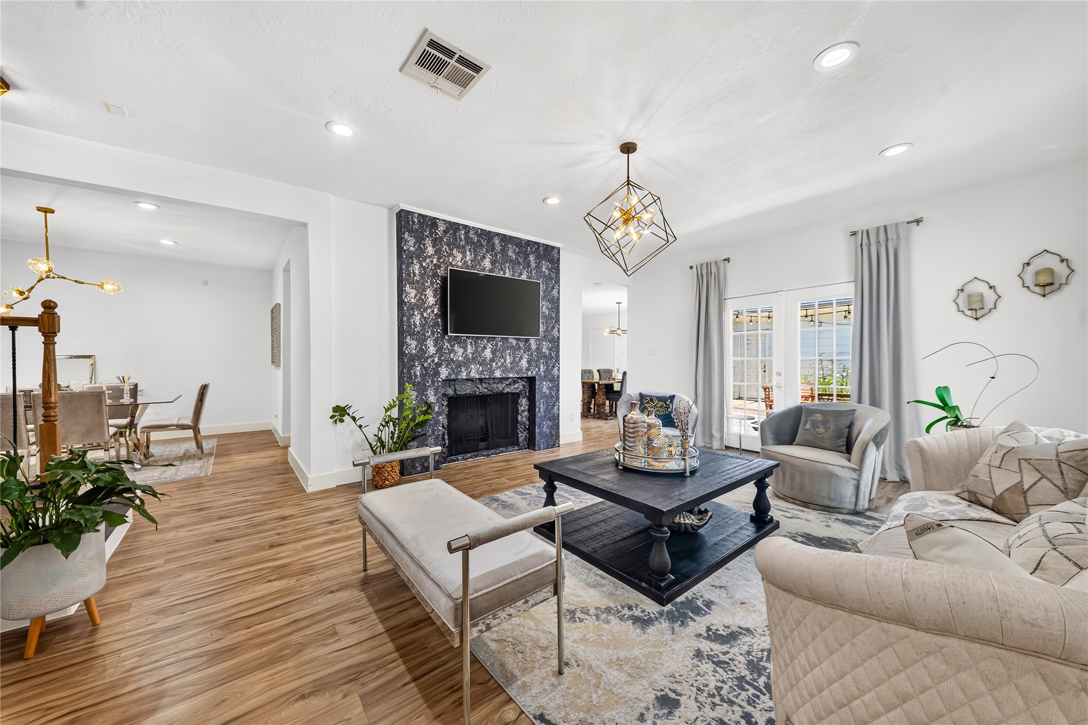 The generous formal living room invites you to relax or host a party by the fireplace The generous formal living room invites you to relax or host a party by the fireplace