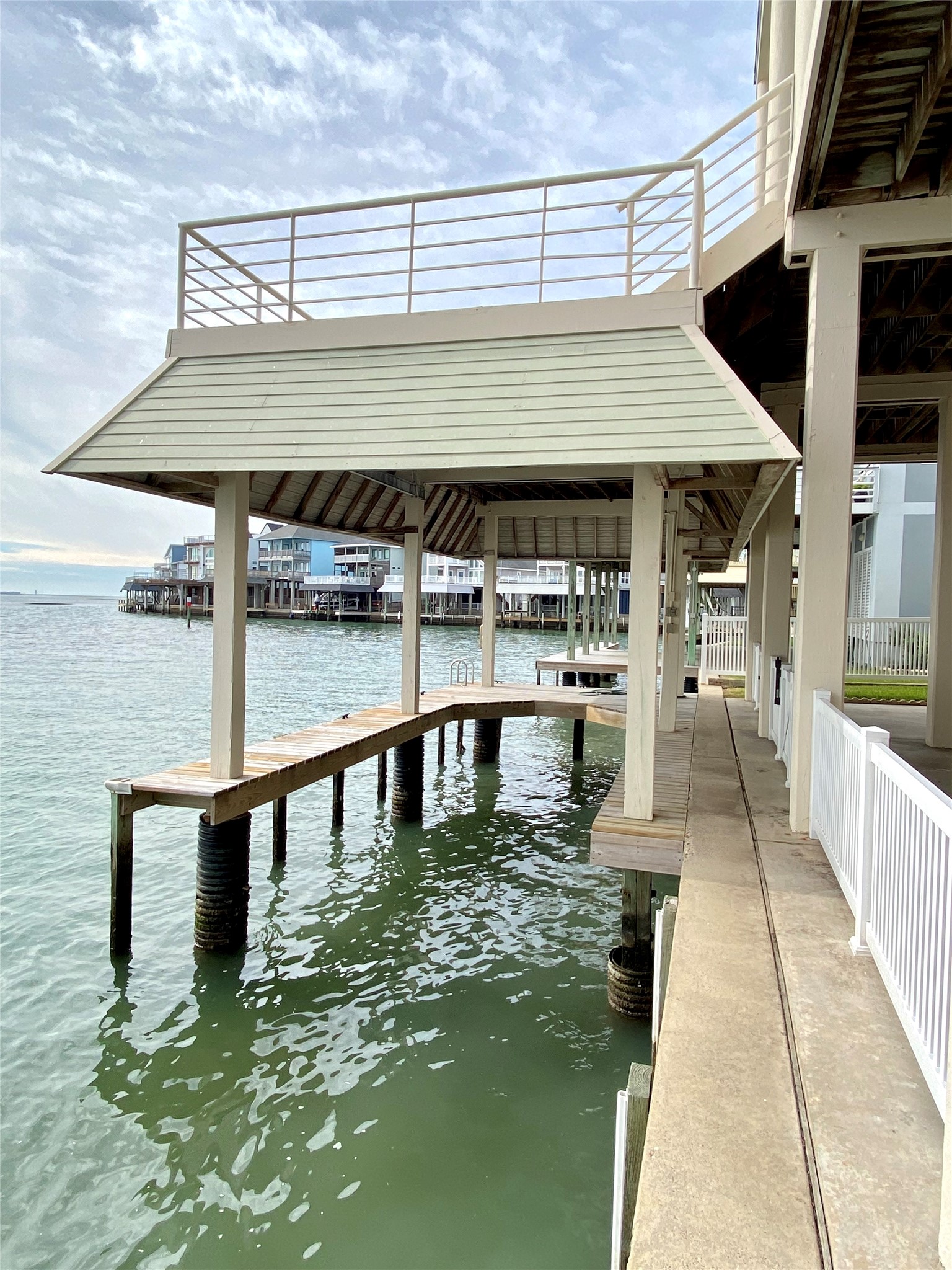 Pull your boat on end after a fun day on the bay in this covered boat slip.