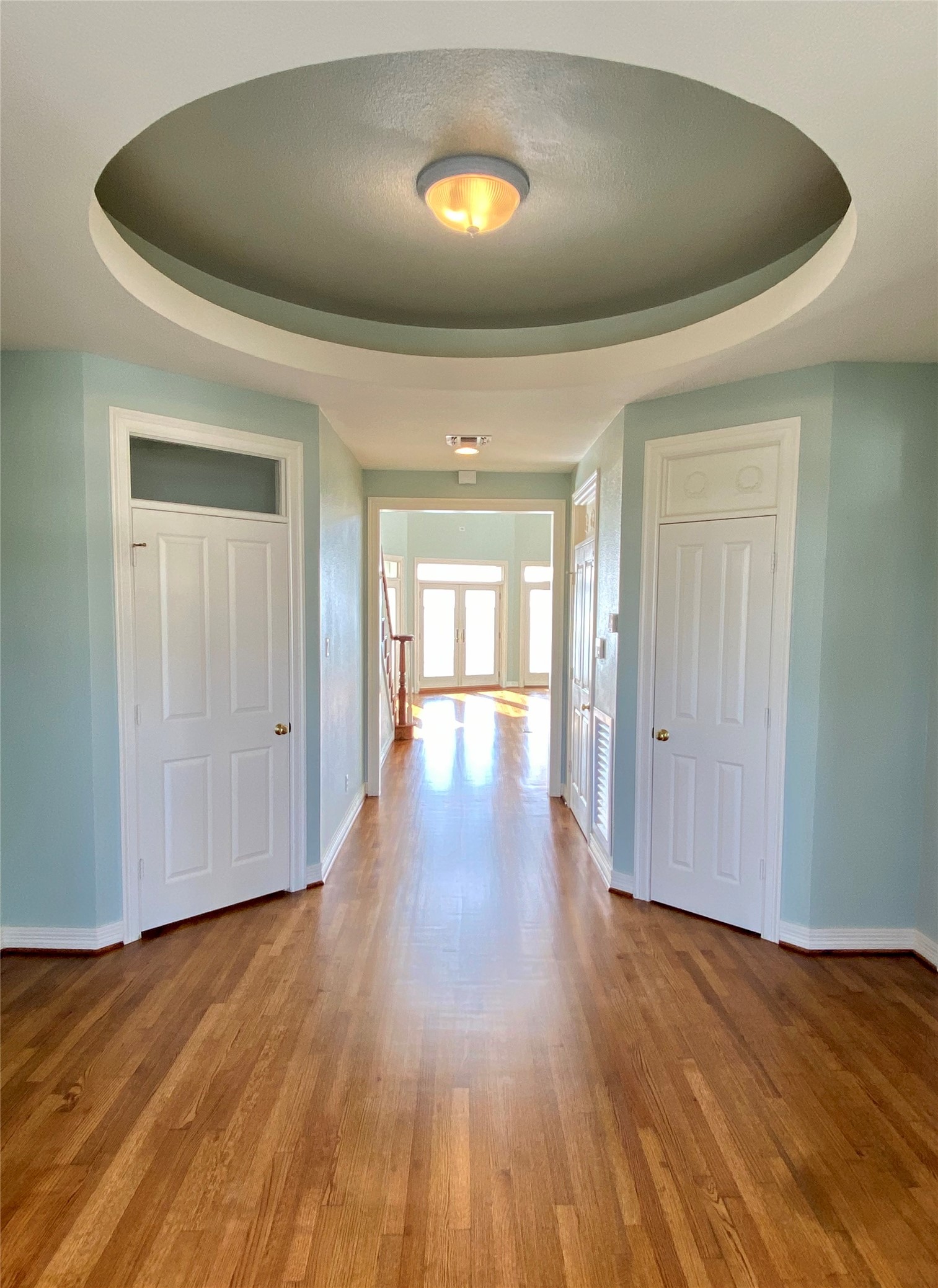 Welcome to this domed foyer. Door to the left leads to an inner staircase from the garage.  On the right is one of many closets.