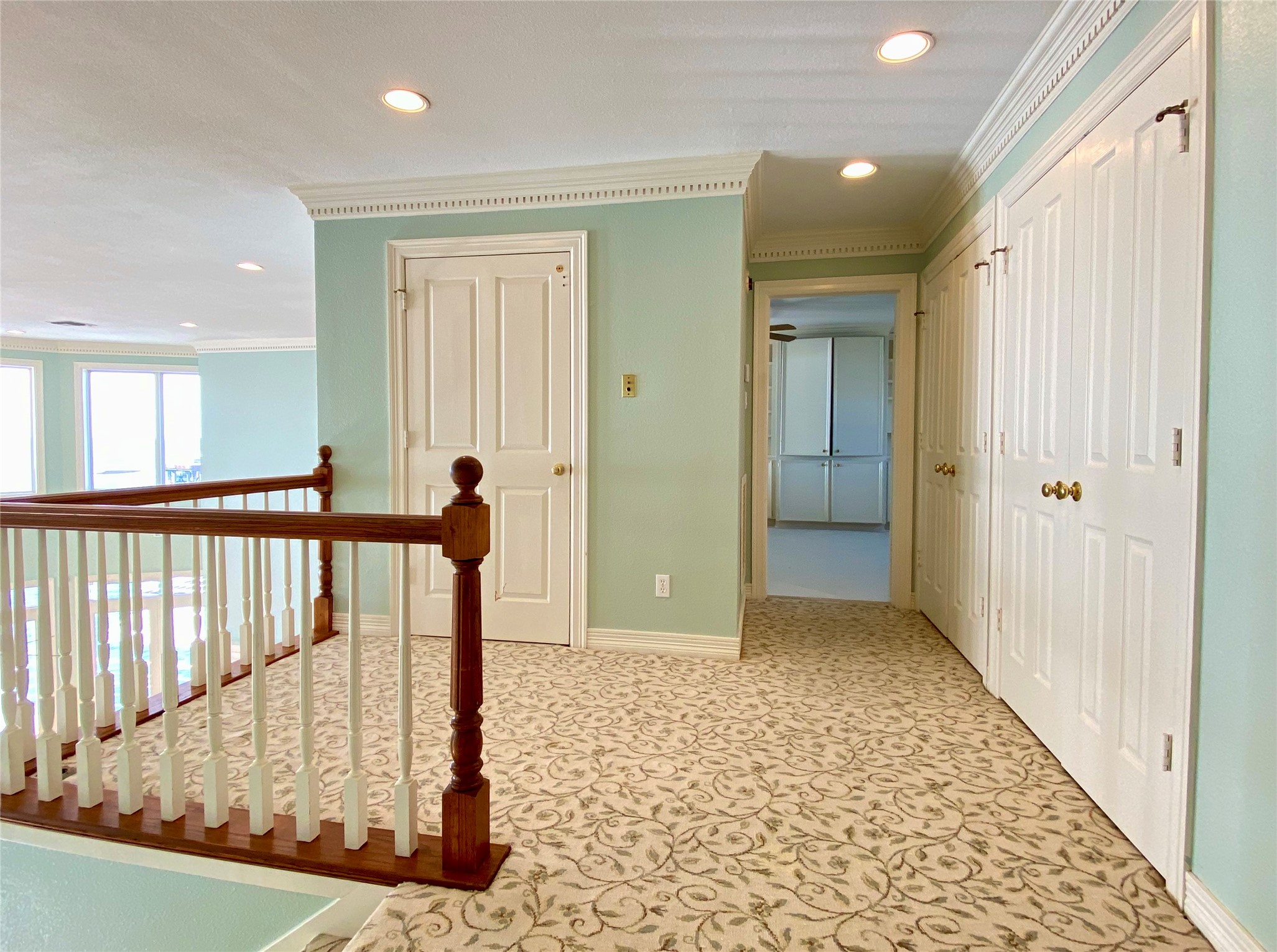The landing at the top of the stairs with tons of storage space in the two closets.  Door on left is the elevator.