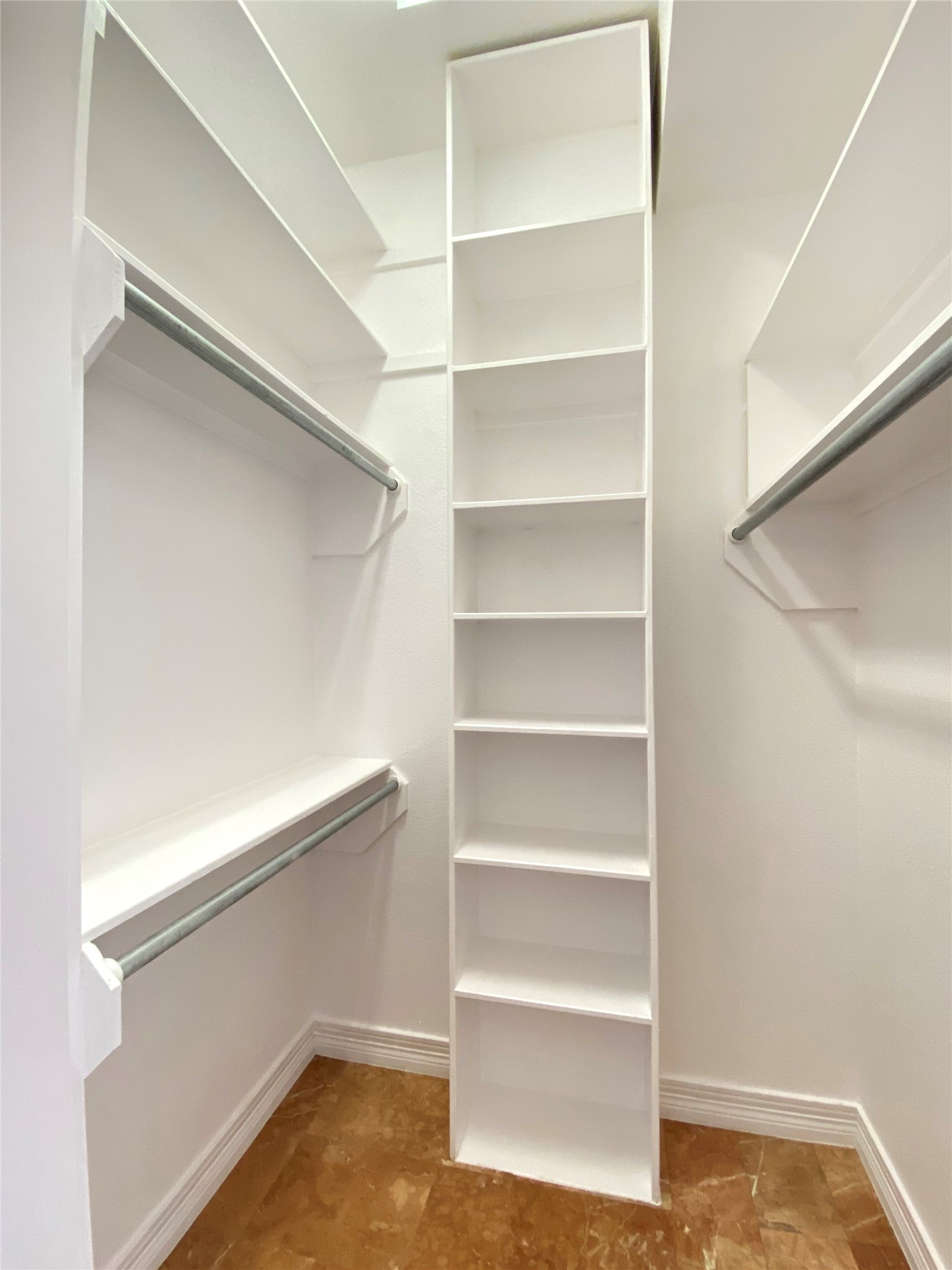 One of two matching closet spaces for the primary bedroom.