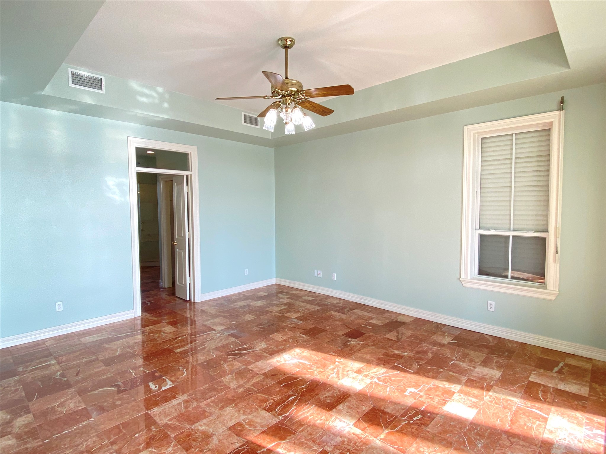 Primary bedroom on main floor with incredible views of the bay to wake up to.