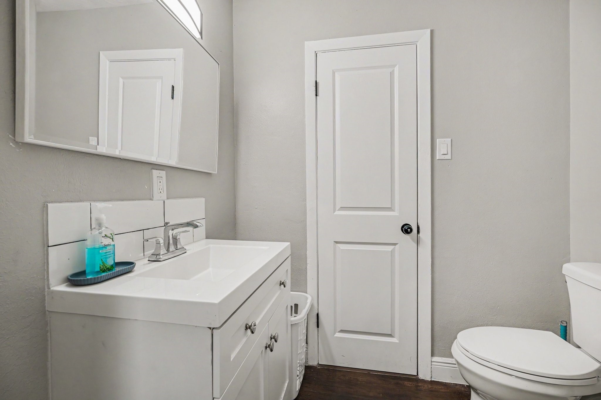 Shared Modern bathroom with elegant tilework and vanity offering a fresh and inviting space.