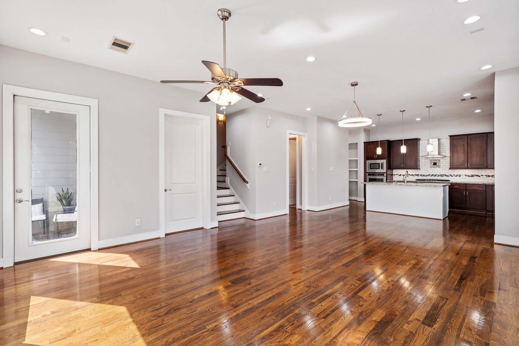 View of the living area showcasing the spacious layout and outdoor balcony.