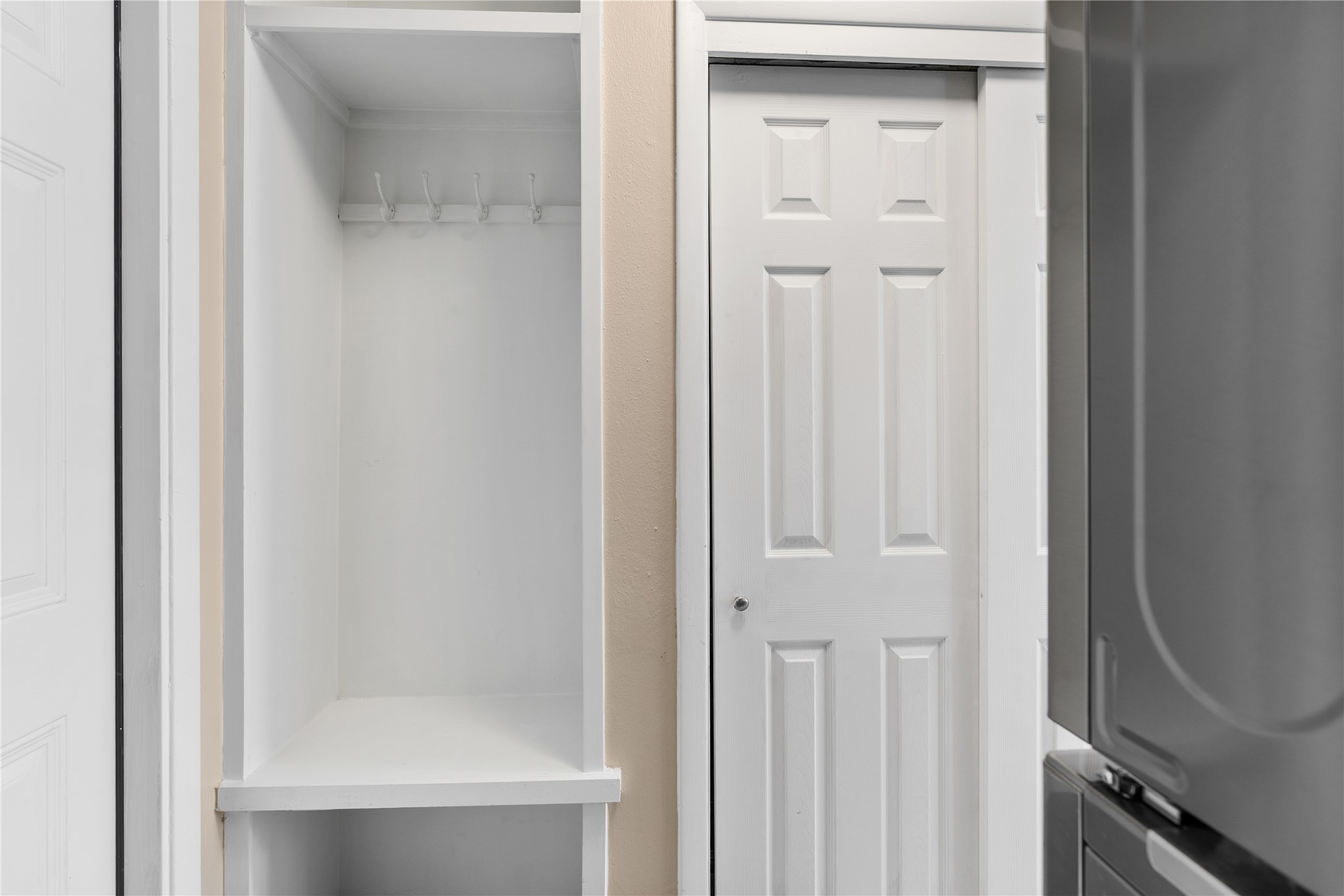 No space is overlooked with a built-in mudroom next to the walk-in pantry and across from the laundry area.