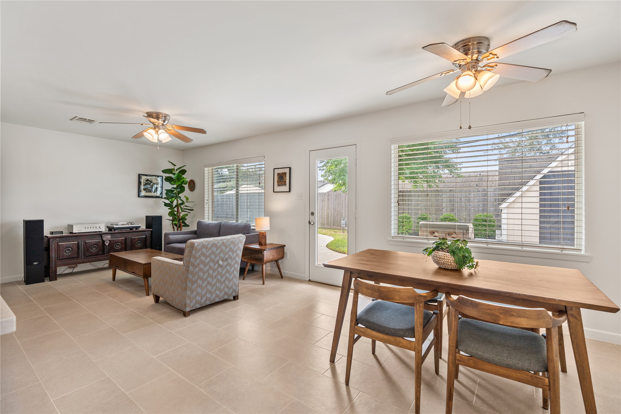 Bright and inviting living space with large windows and seamless flow to the backyard. Bright and inviting living space with large windows and seamless flow to the backyard.