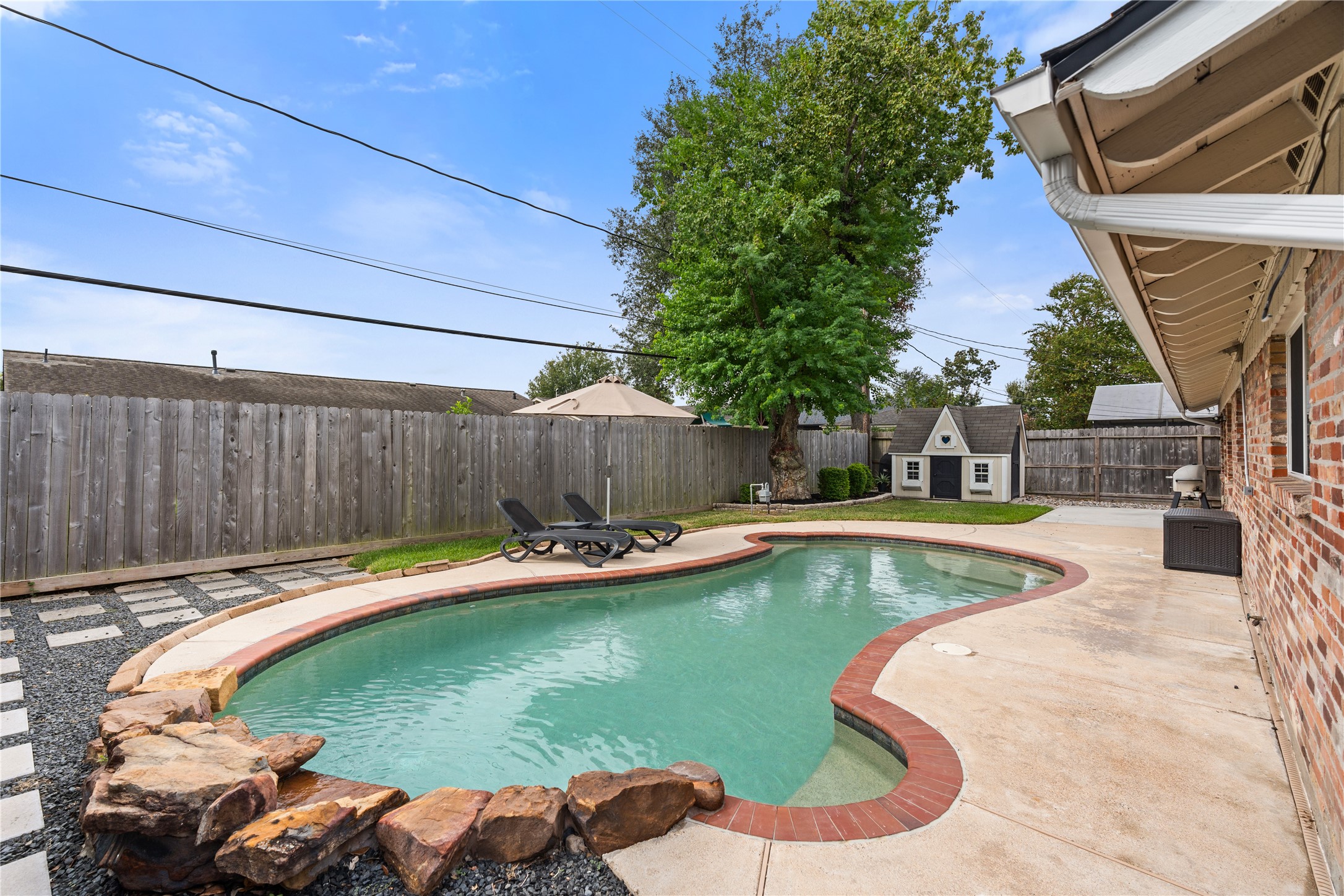 Made for Houston summers, the pool features tranquil rock water fall, mature shade tree + plenty of room to lounge. Recent pool pump + hardscaping updates make it as functional as it is fun.