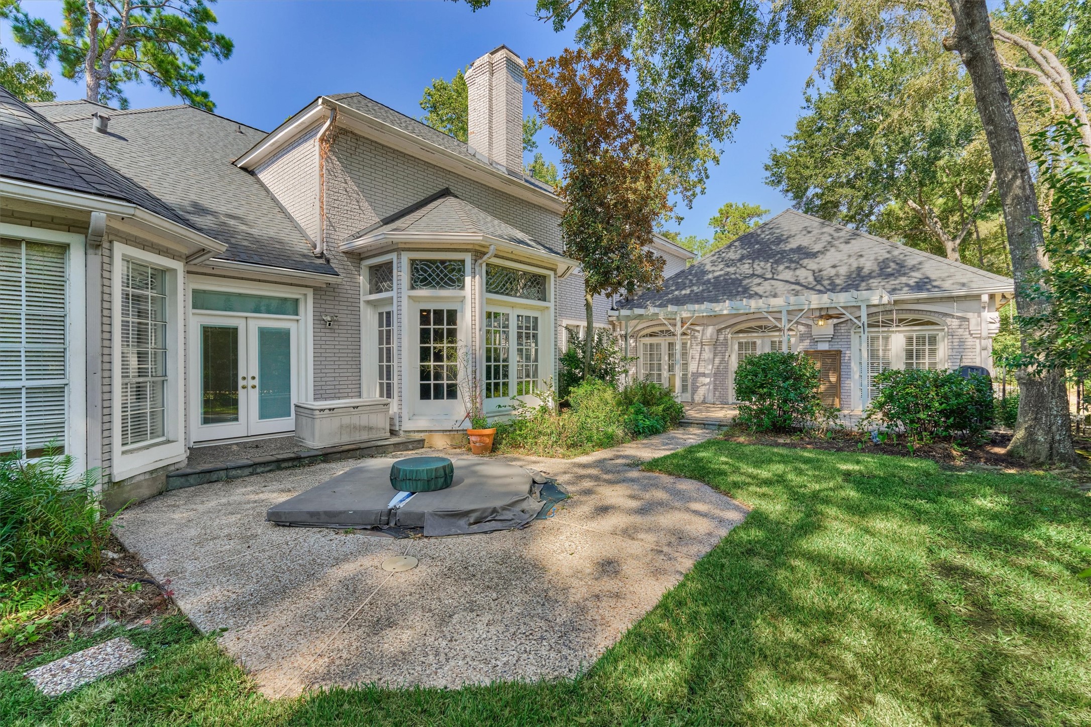 Private backyard with in-ground spa and patio.