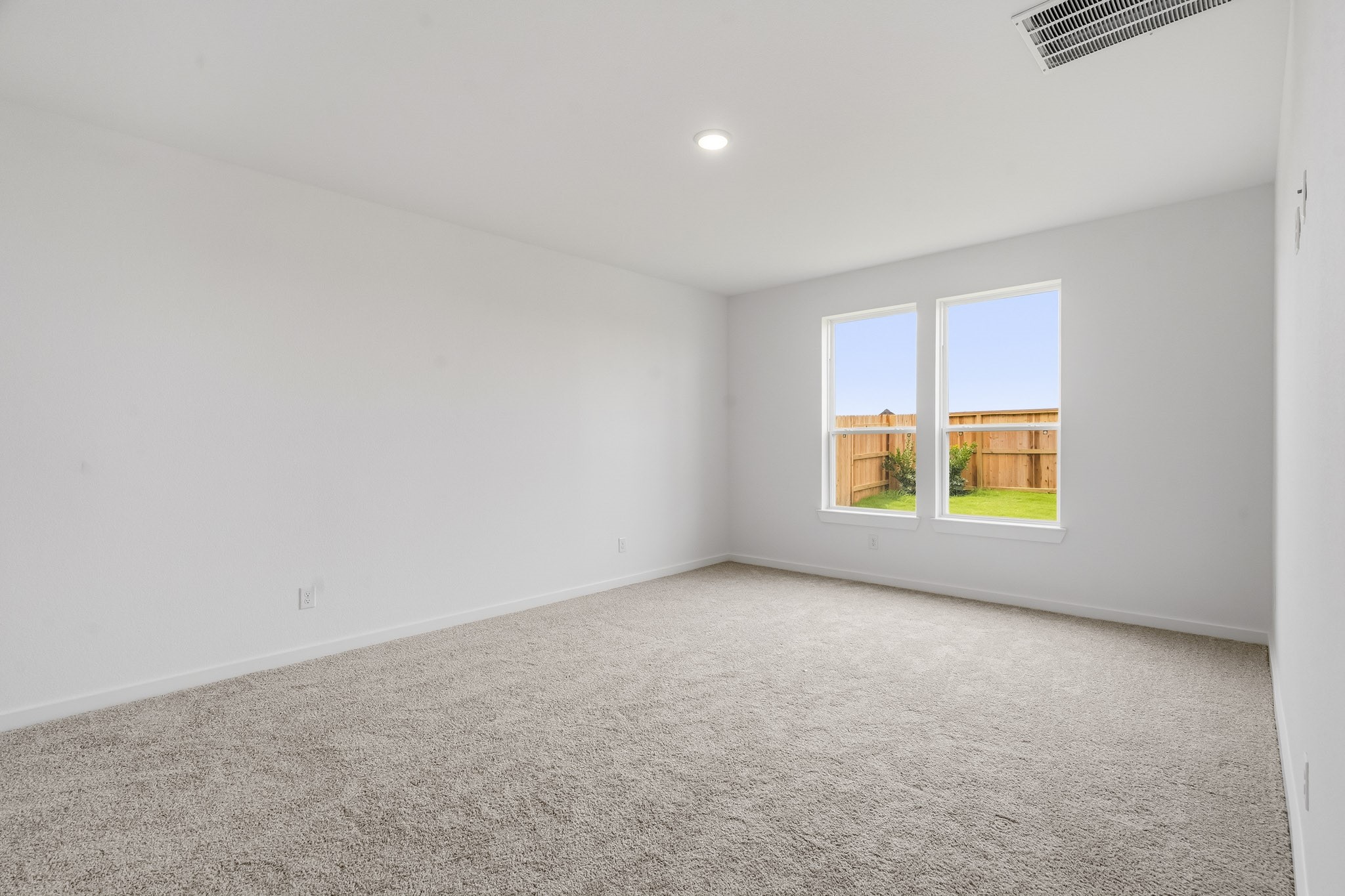 The main bedroom faces the back with no rear neighbors.