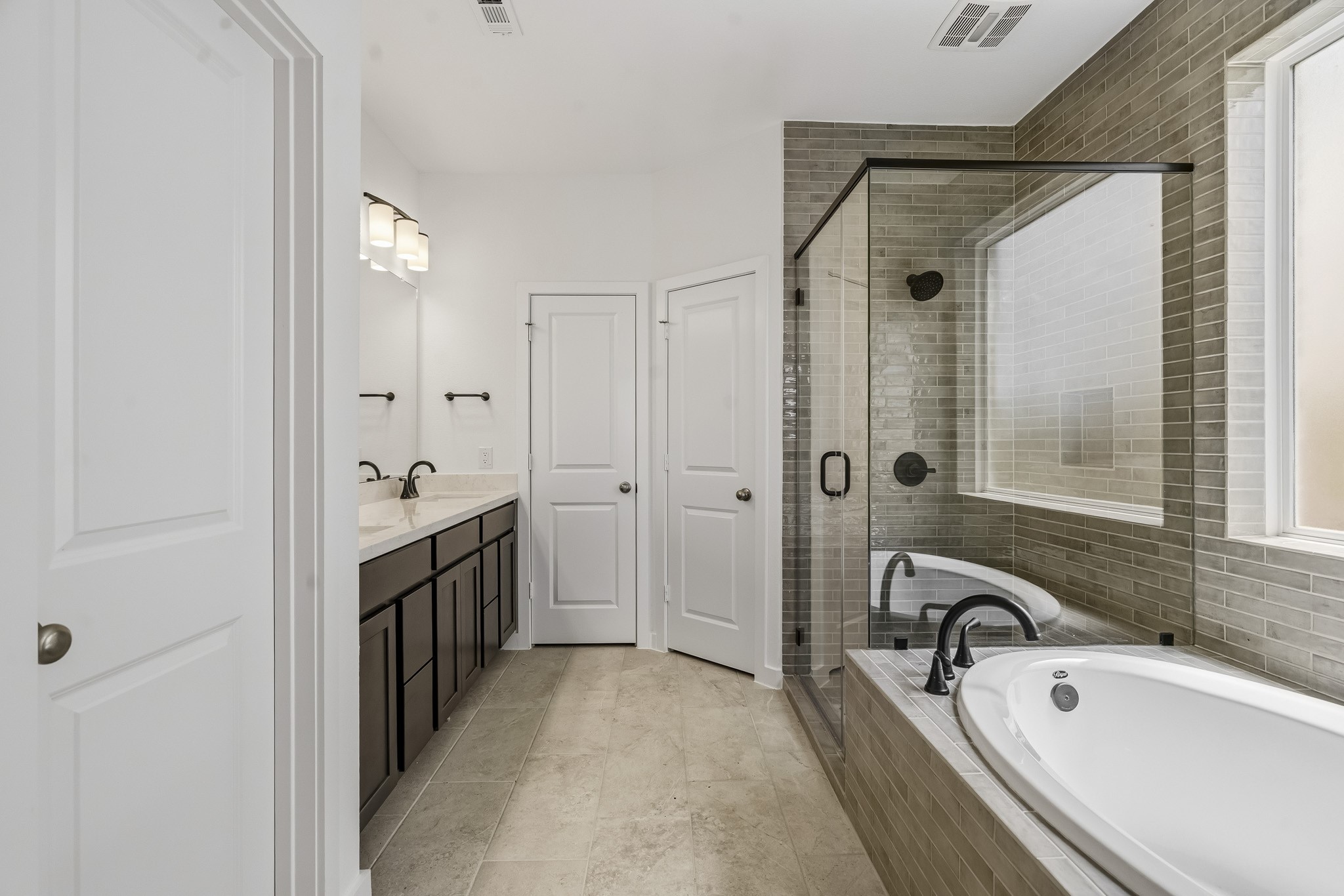 Separate shower and tub in the main bath.