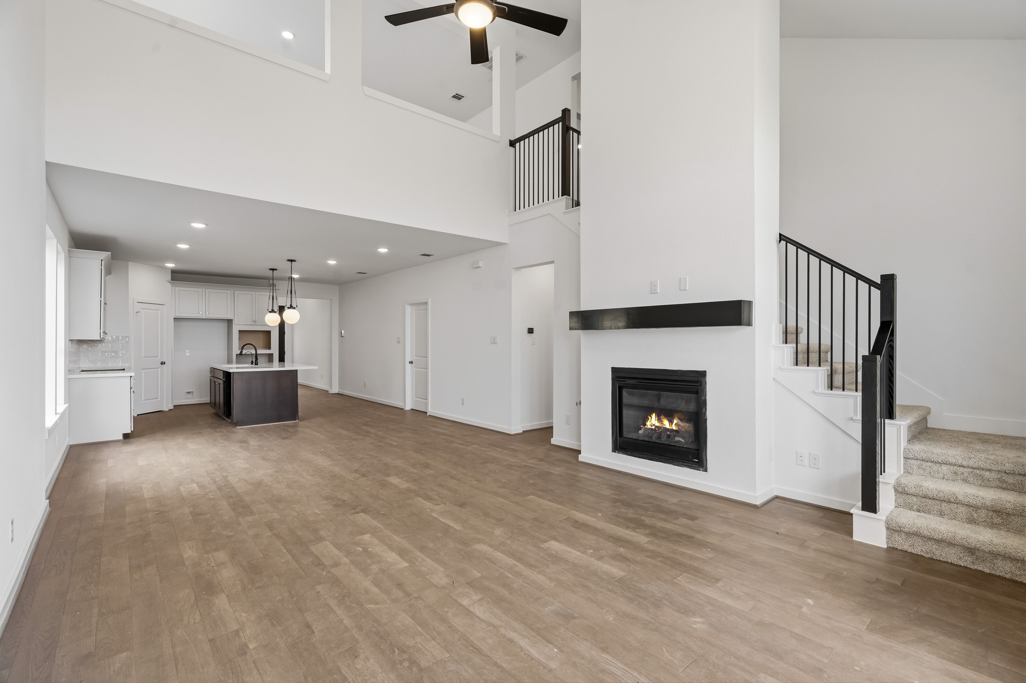 The open family room is completed with a fireplace. The open family room is completed with a fireplace.