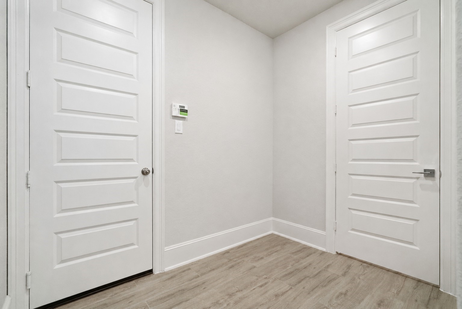 The mud room pictured here, leads to the 3.5 car garage (door to the left), the utility room (door to the right), and a huge walk-in pantry (door not shown).