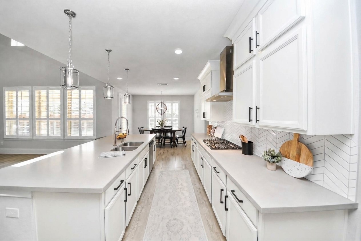 Experience the bright and modern charm of this kitchen, where crisp white cabinets create a fresh and inviting atmosphere, showcasing the potential of a simple transformation.