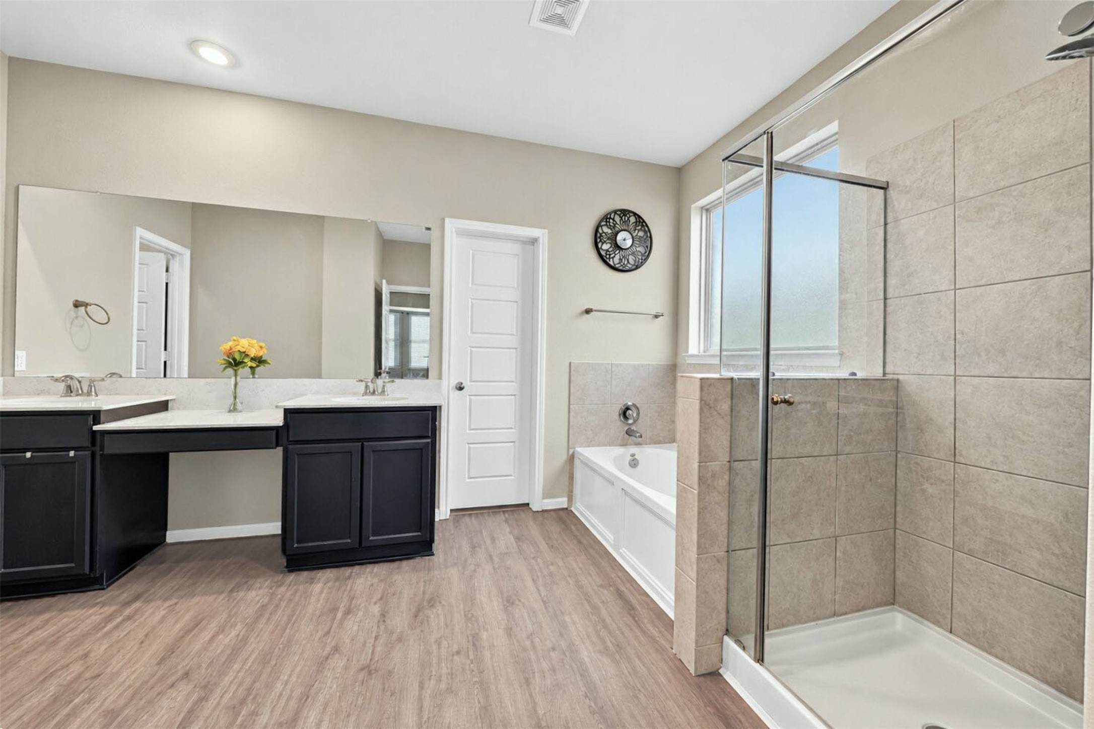Primary Bath features dual sinks, vanity area and soaking tub with seperate shower!