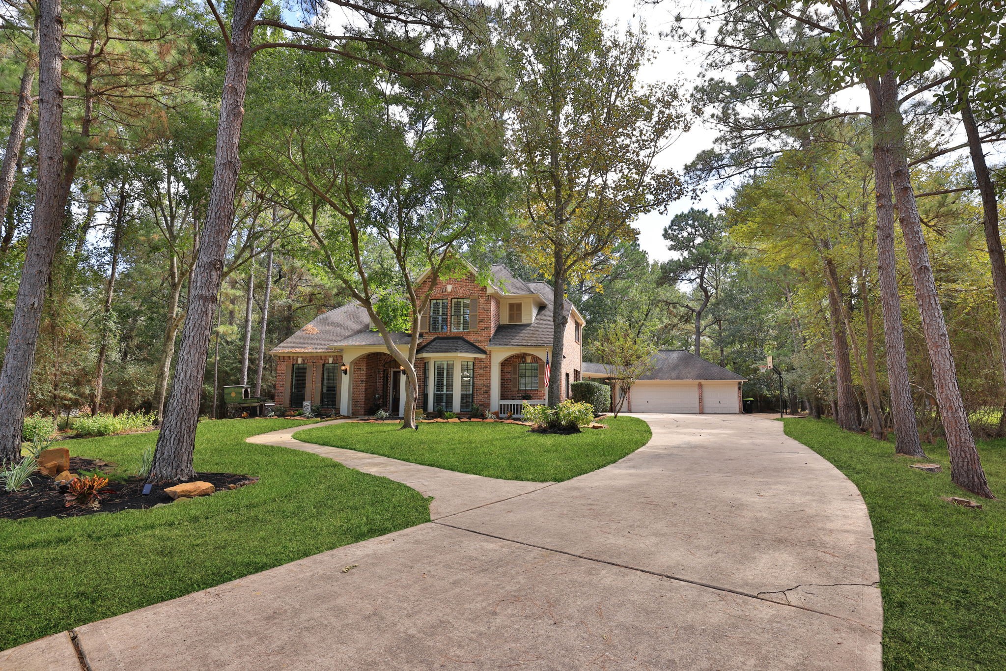 Home features oversized 3 car garage and professional landscaping