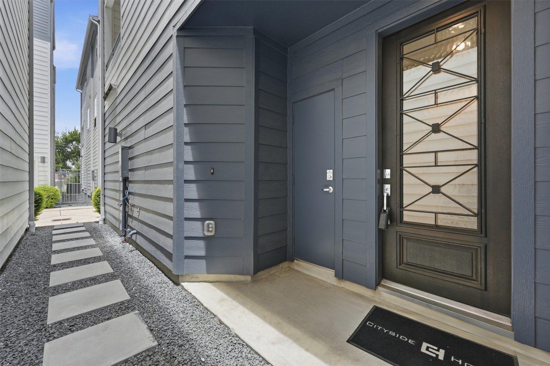 Enjoy the convenience of a private mailbox room right by your sleek, modern entrance, adding both style and security to your home.