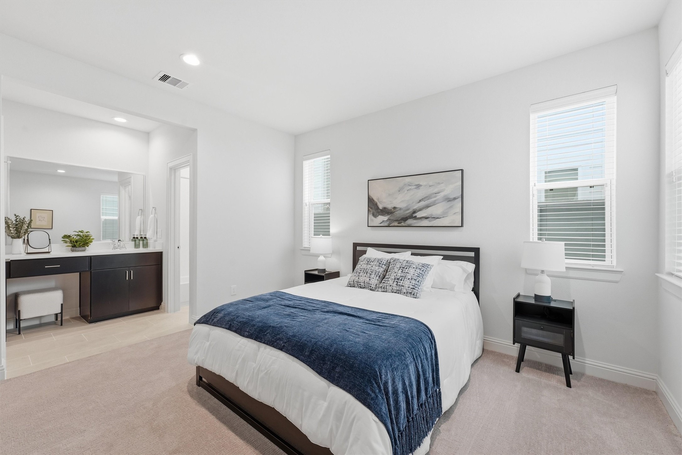 Indulge in ultimate comfort with this elegant guest suite, featuring a cozy bedroom and private en-suite bathroom for a perfect relaxing retreat.